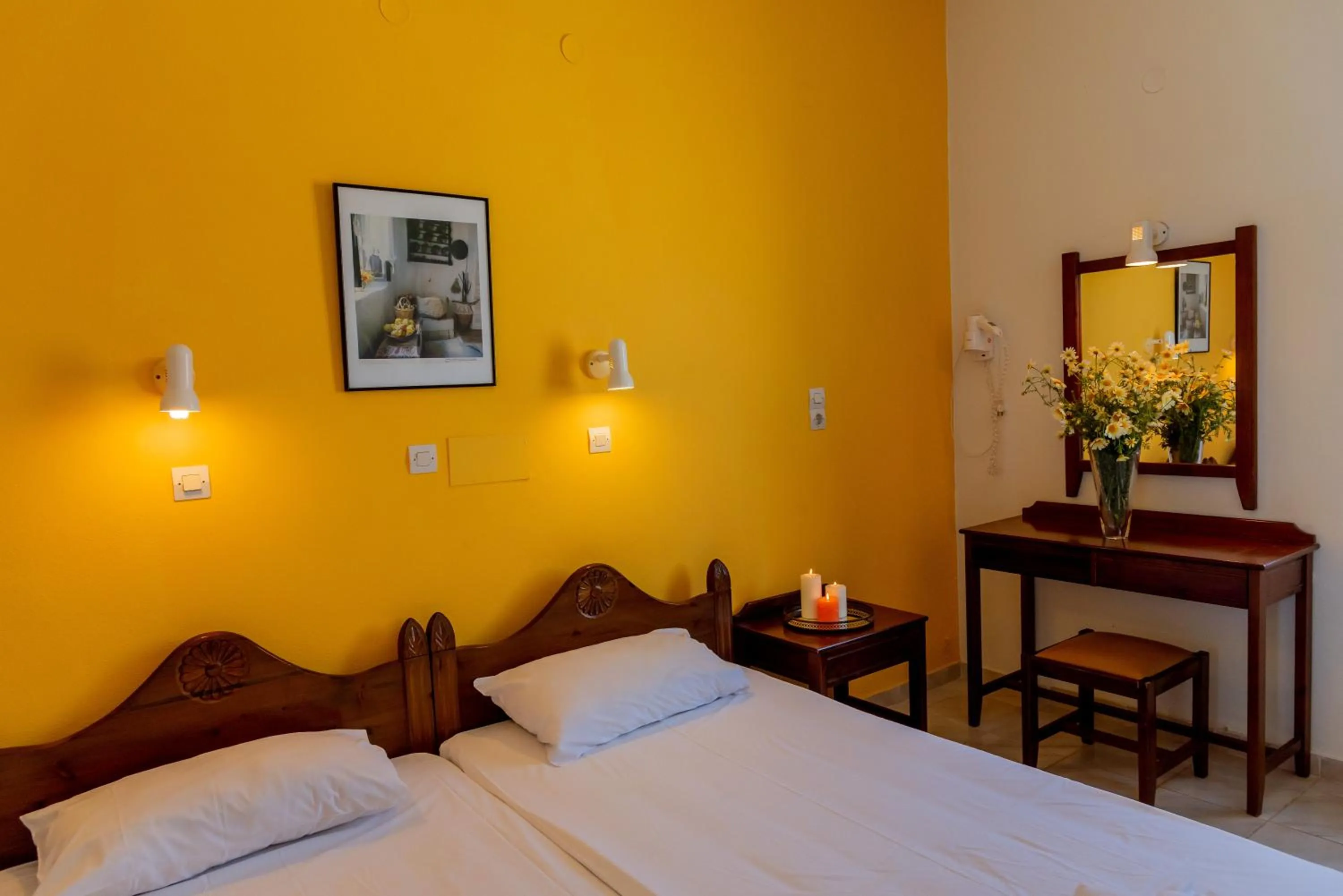 Bed in Almyra Apartments & Suites