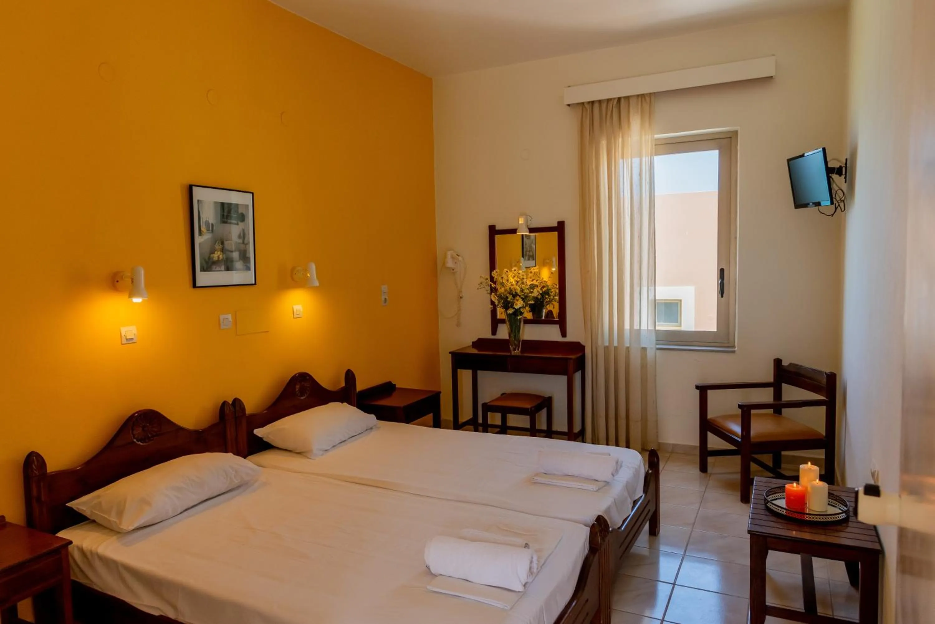 Bed in Almyra Apartments & Suites