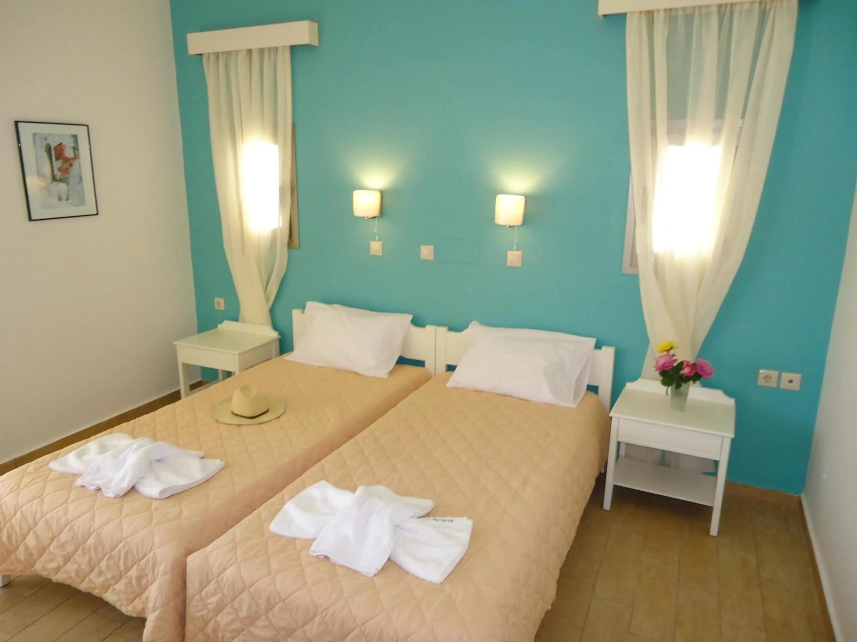 Bed in Almyra Apartments & Suites