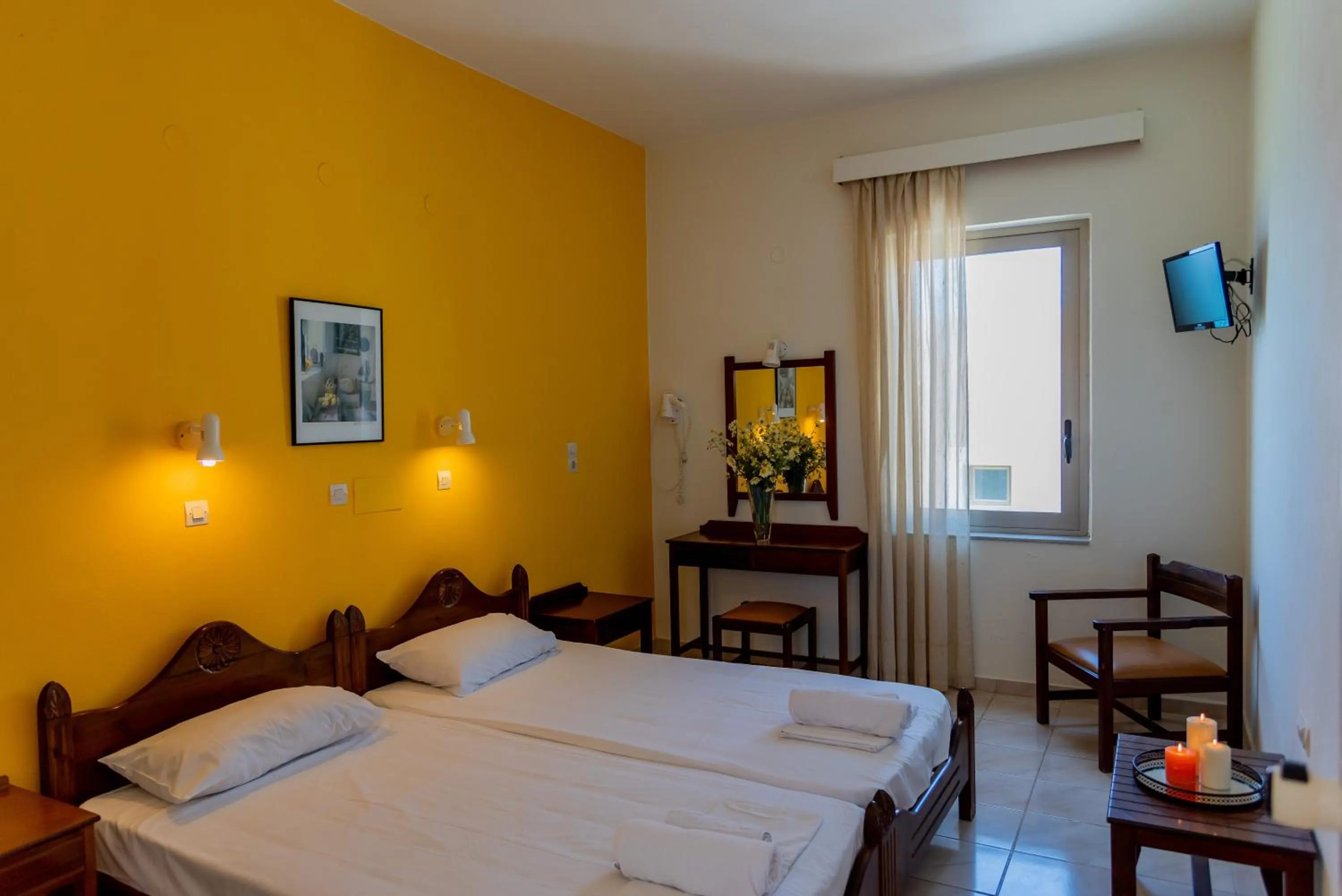 Bed in Almyra Apartments & Suites