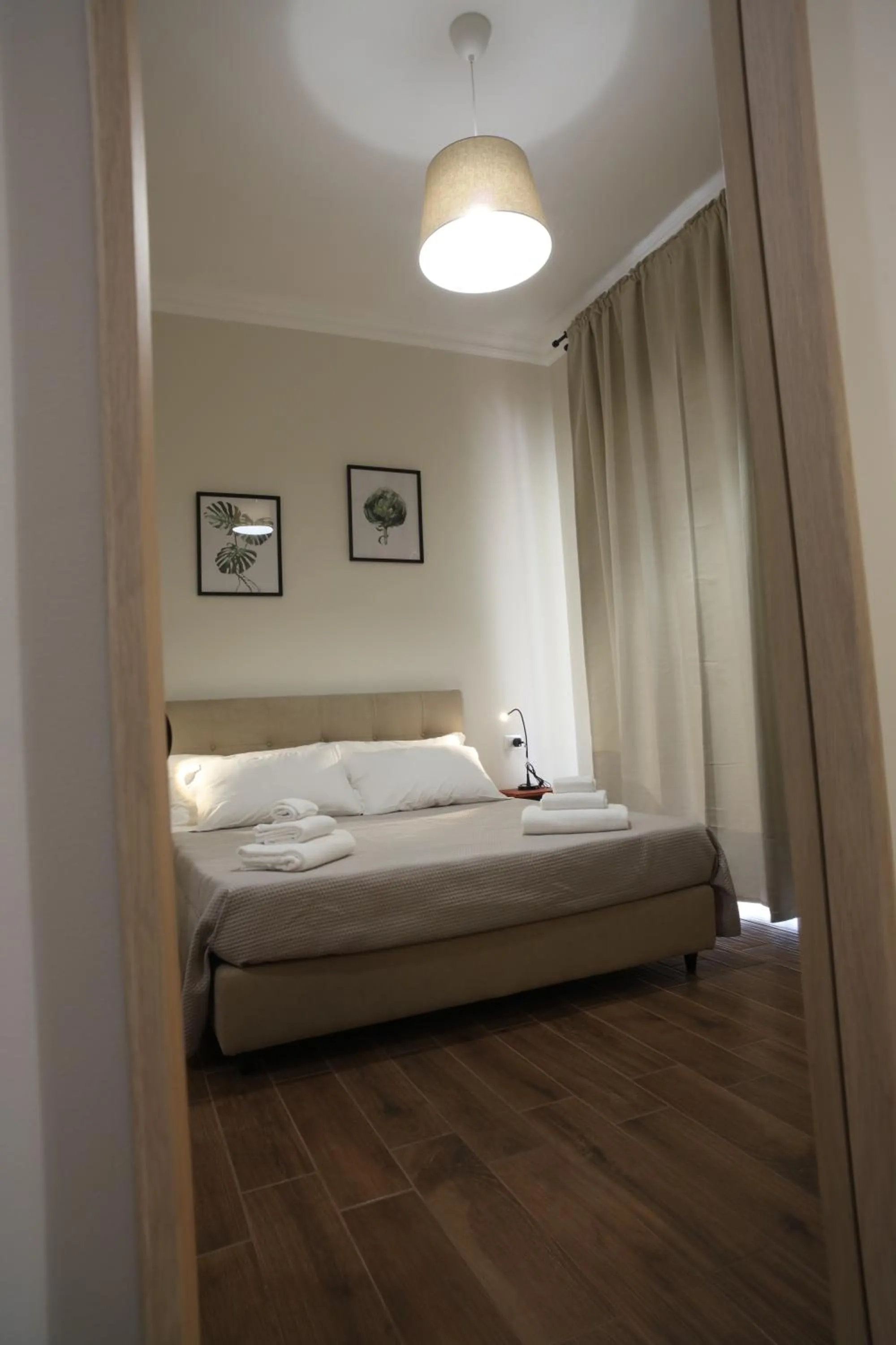 Bed in Khome Rooms & Apartment