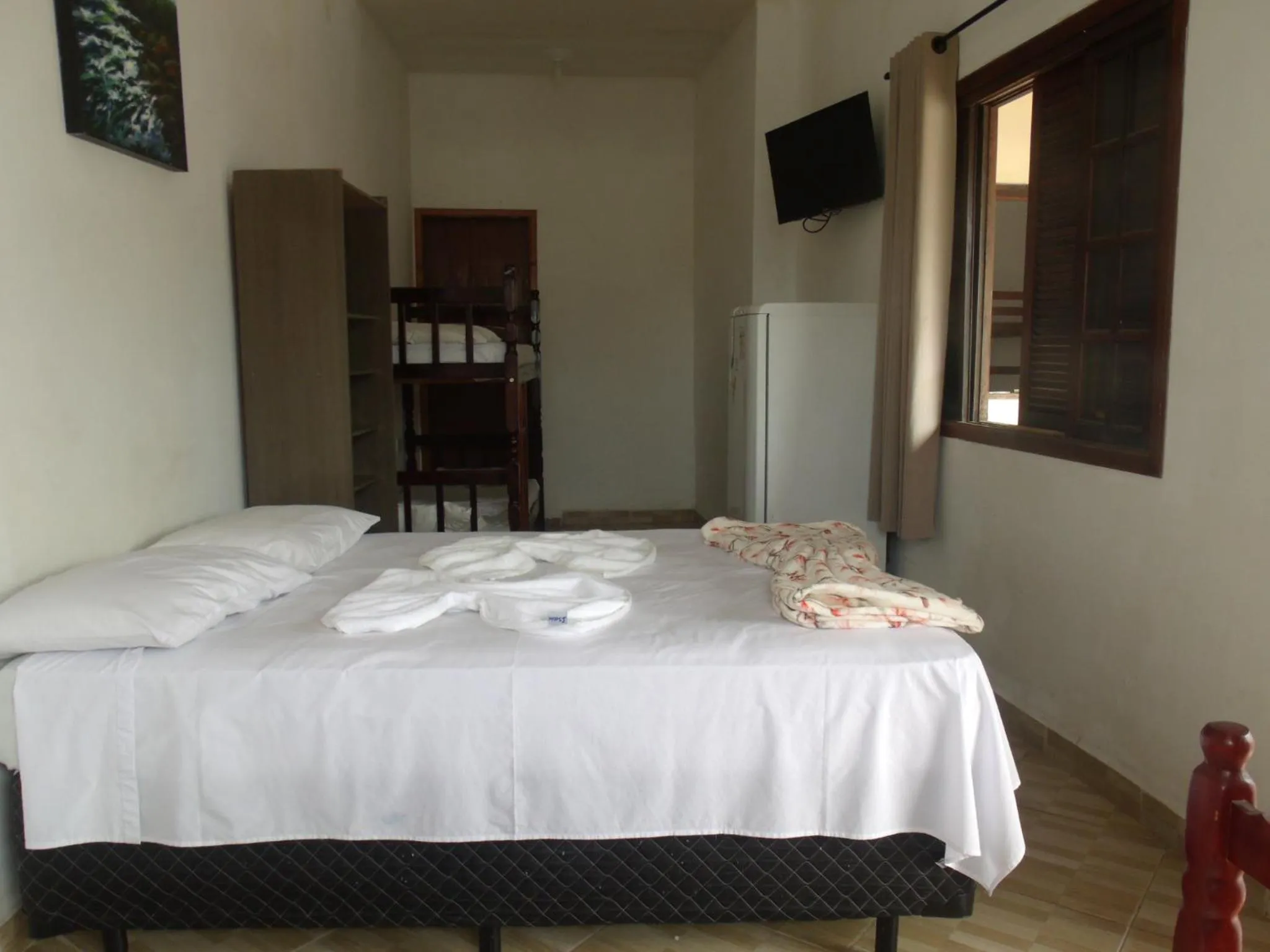 Bed in Pousada Edson