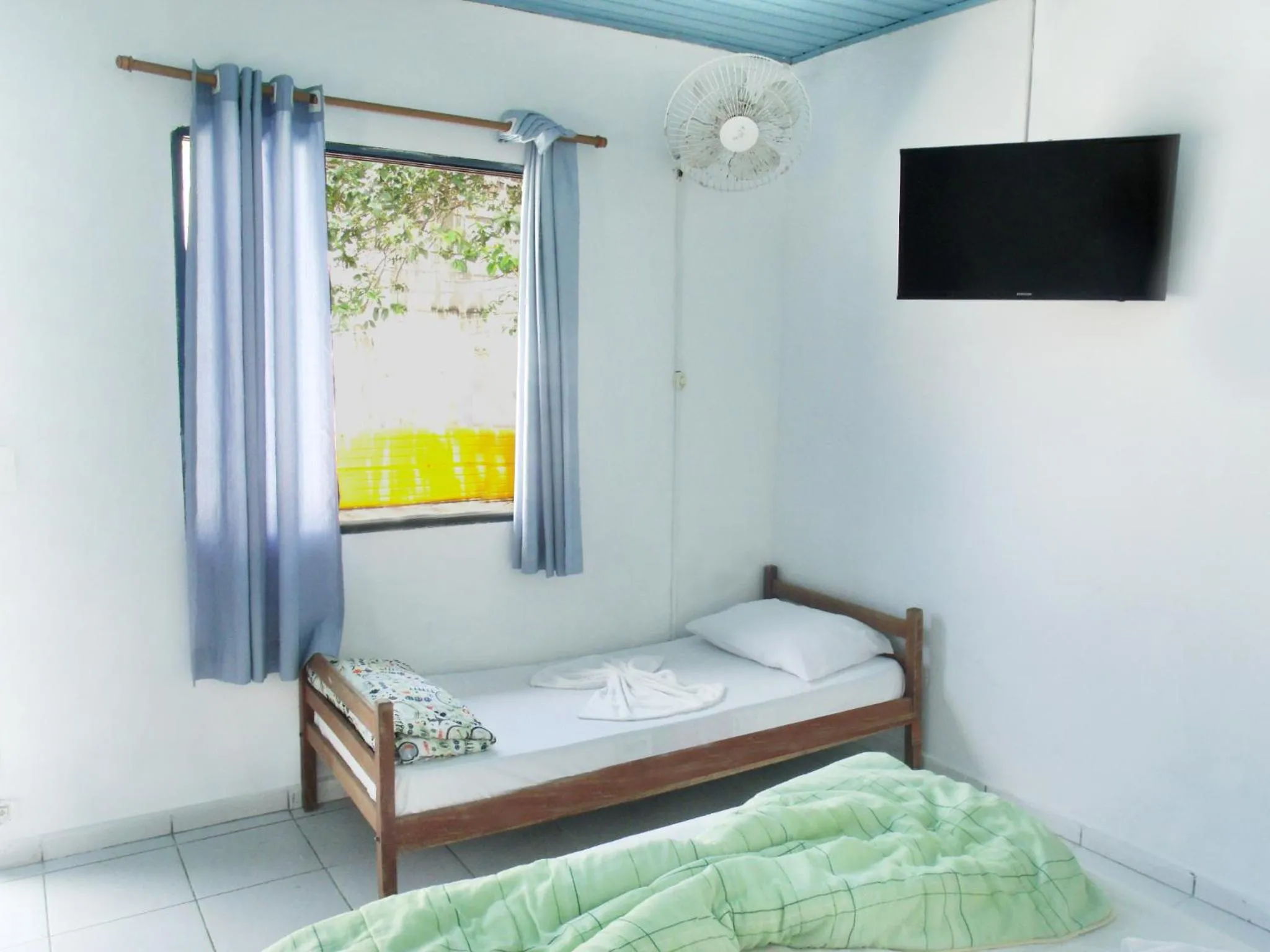 Bed in Pousada Edson