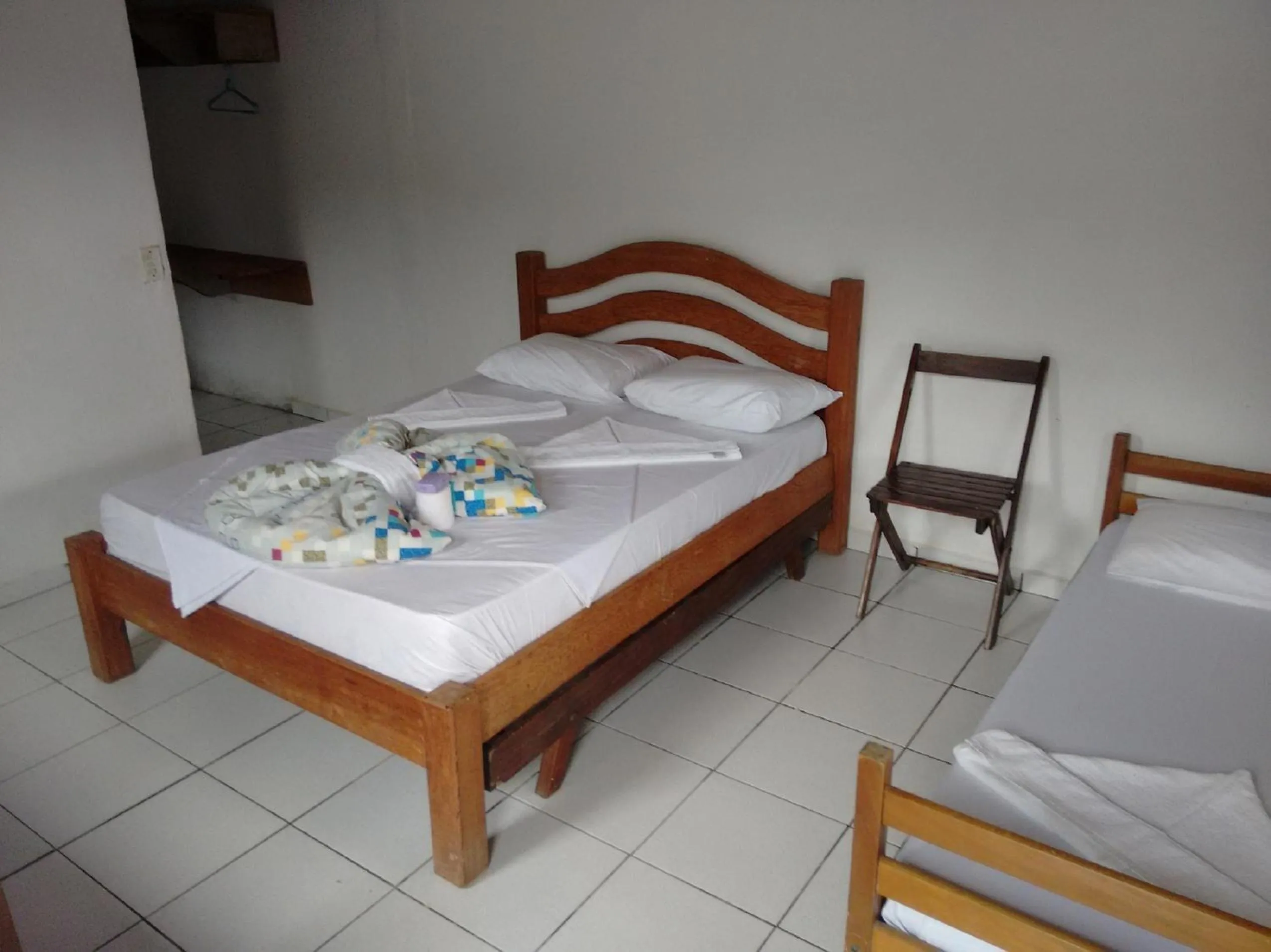 Bed in Pousada Edson