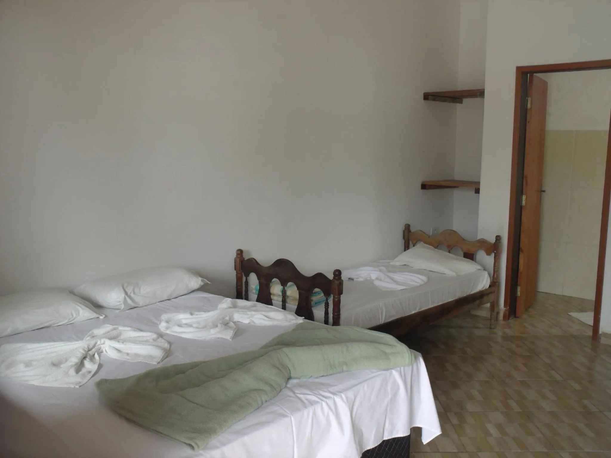 Bed in Pousada Edson