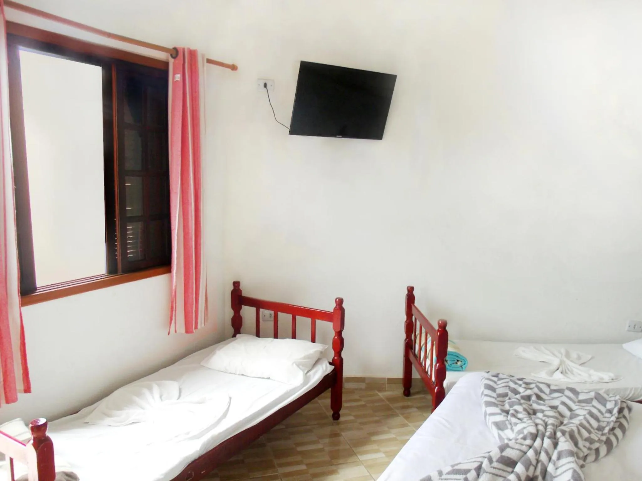 Bed in Pousada Edson