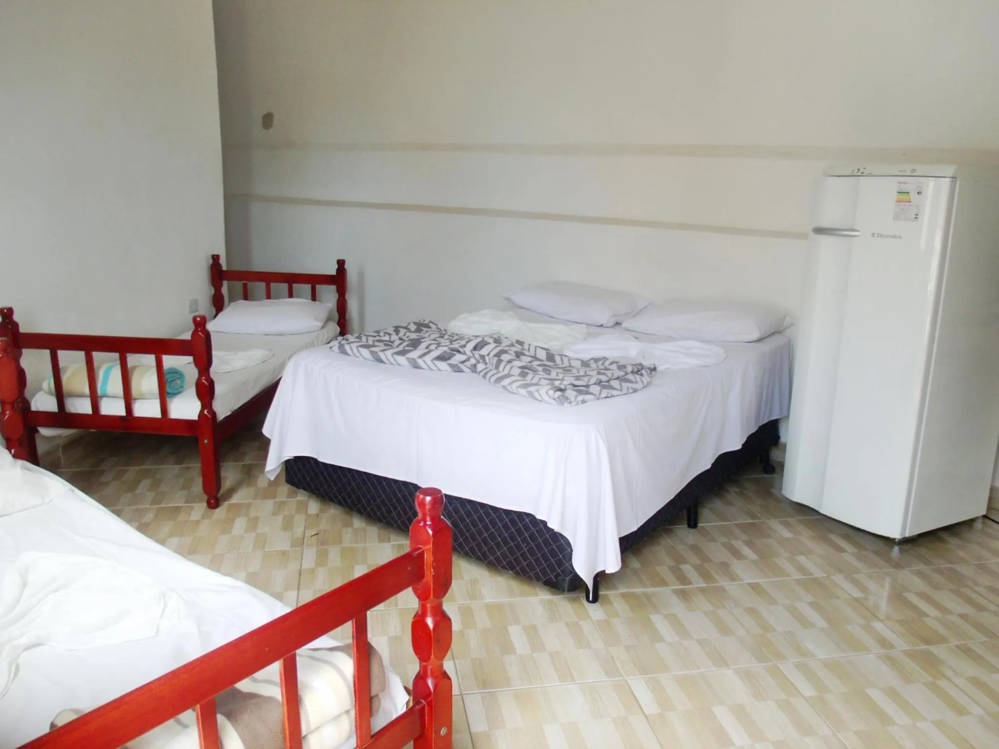 Bed in Pousada Edson