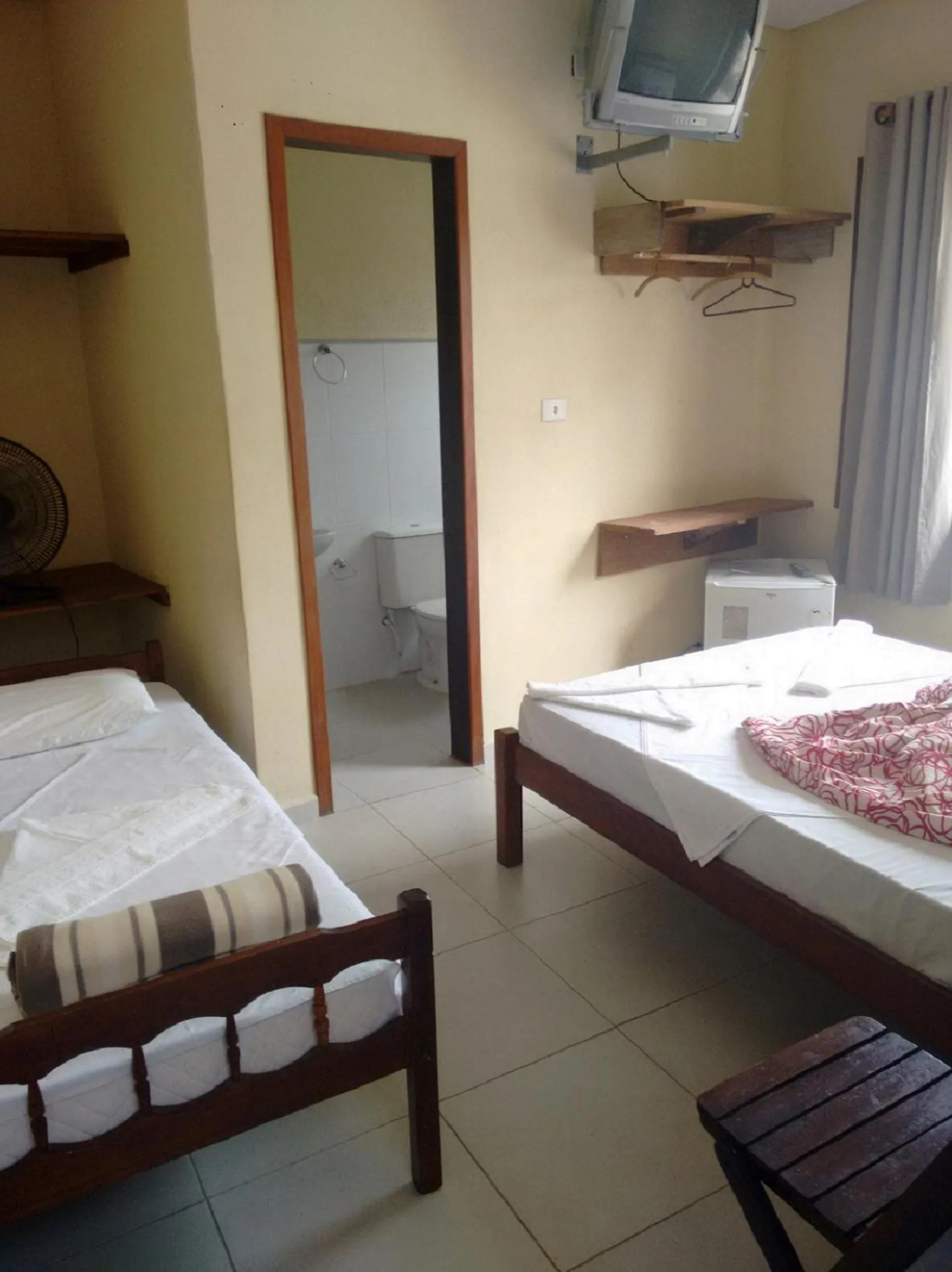 Bed in Pousada Edson