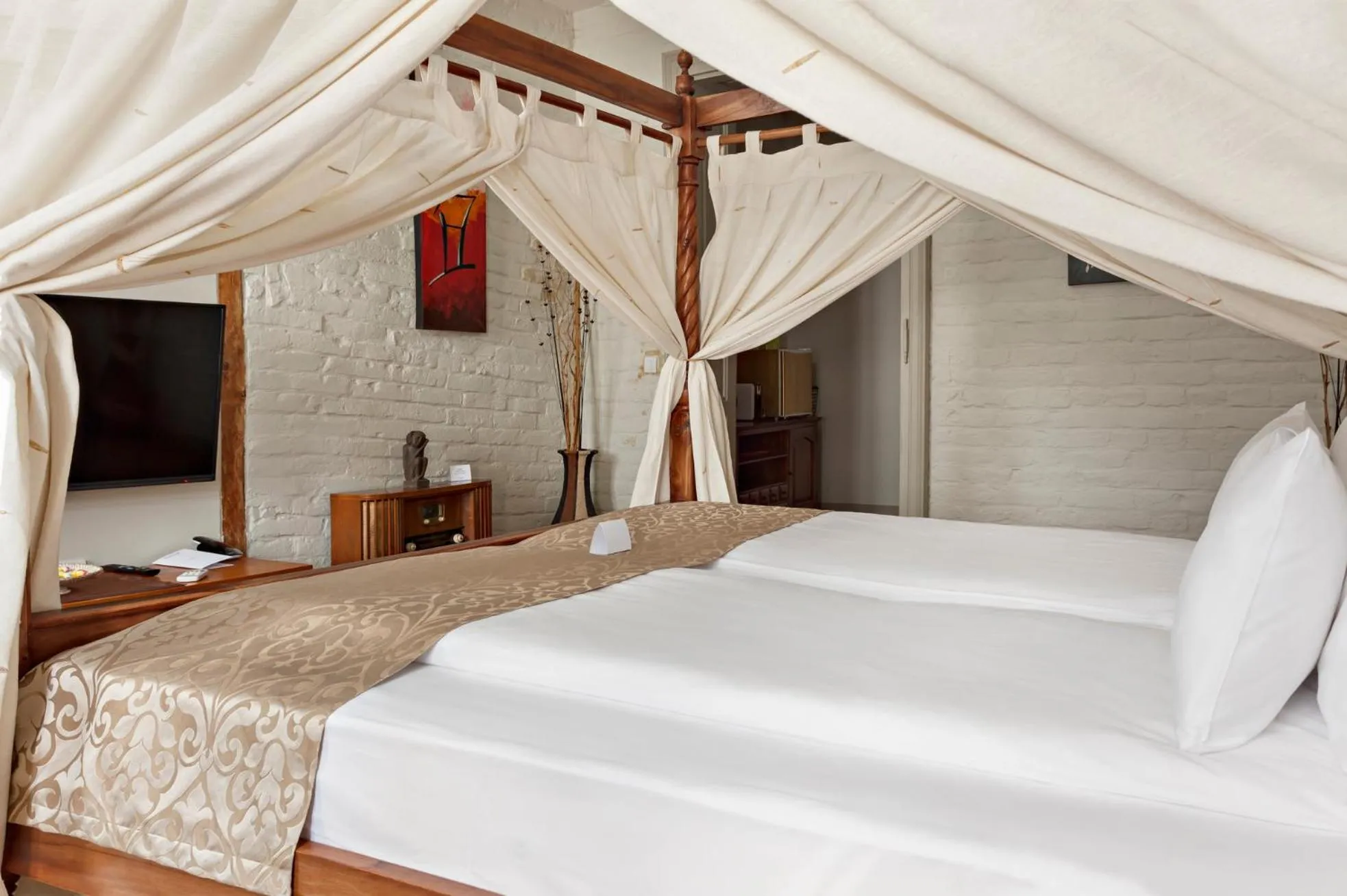 Bed in SuperB Luxury Suites