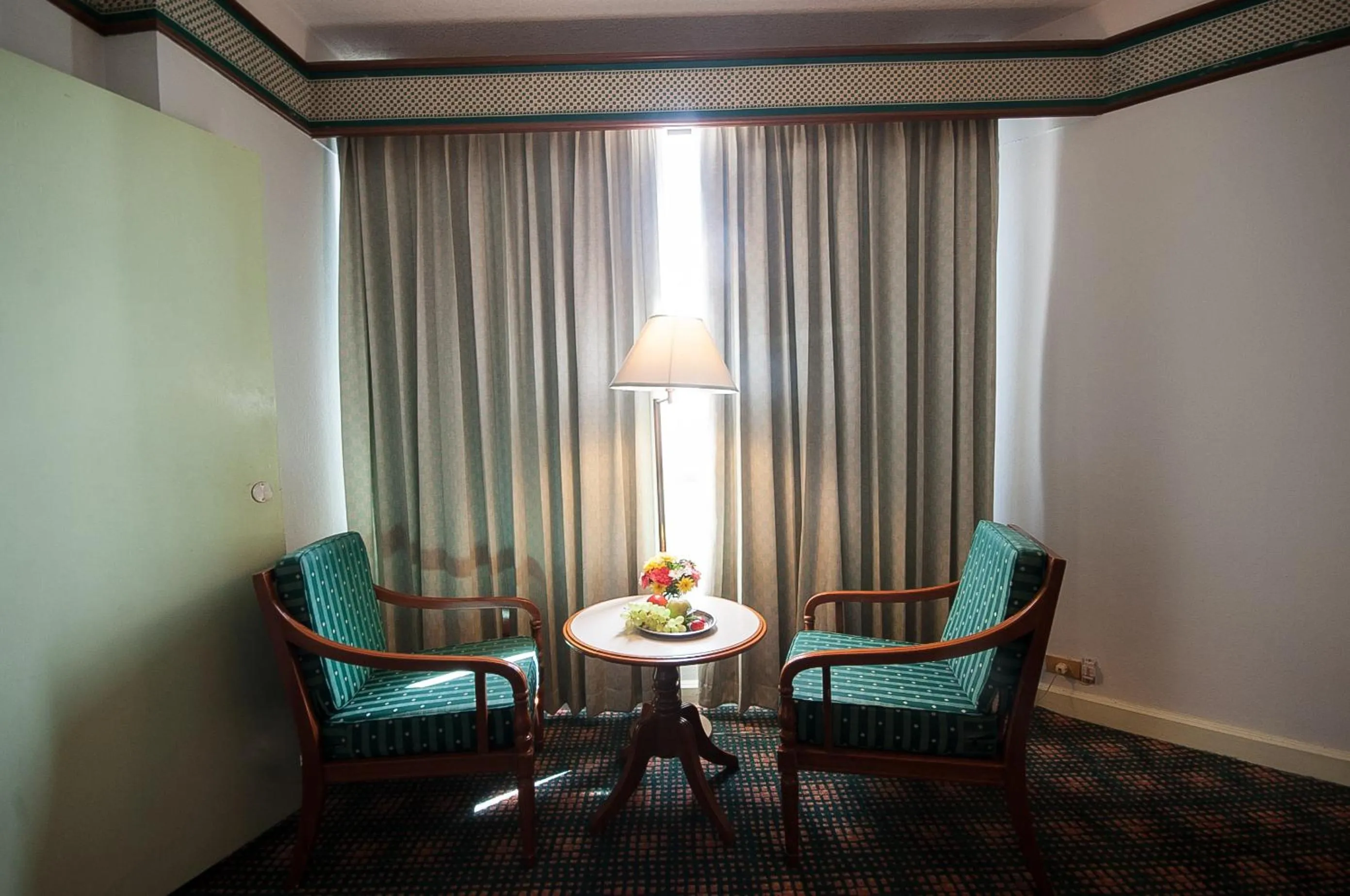 Seating area in Diamond Plaza Hotel