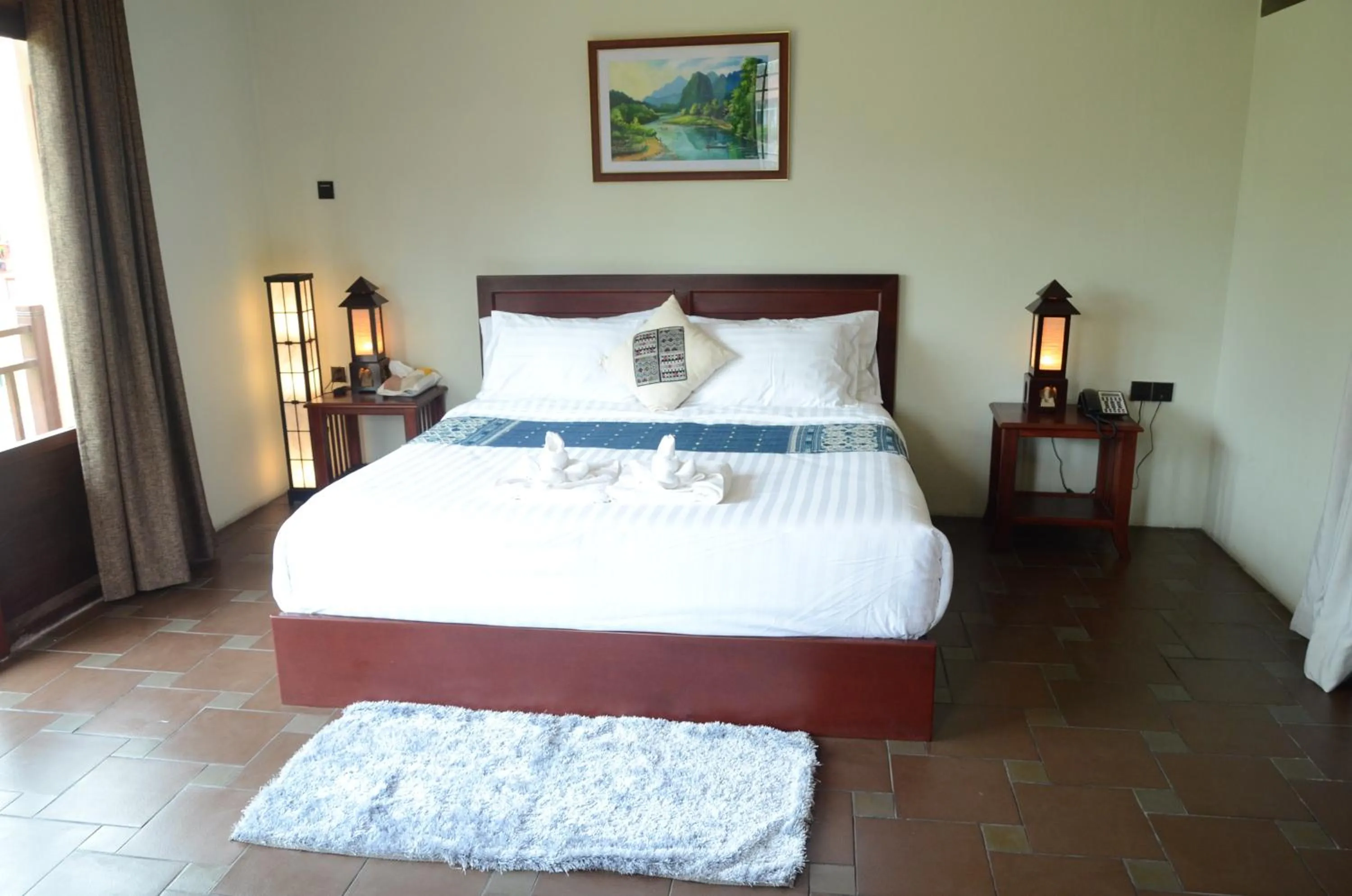 Bed in Saksiri Riverside Boutique Hotel