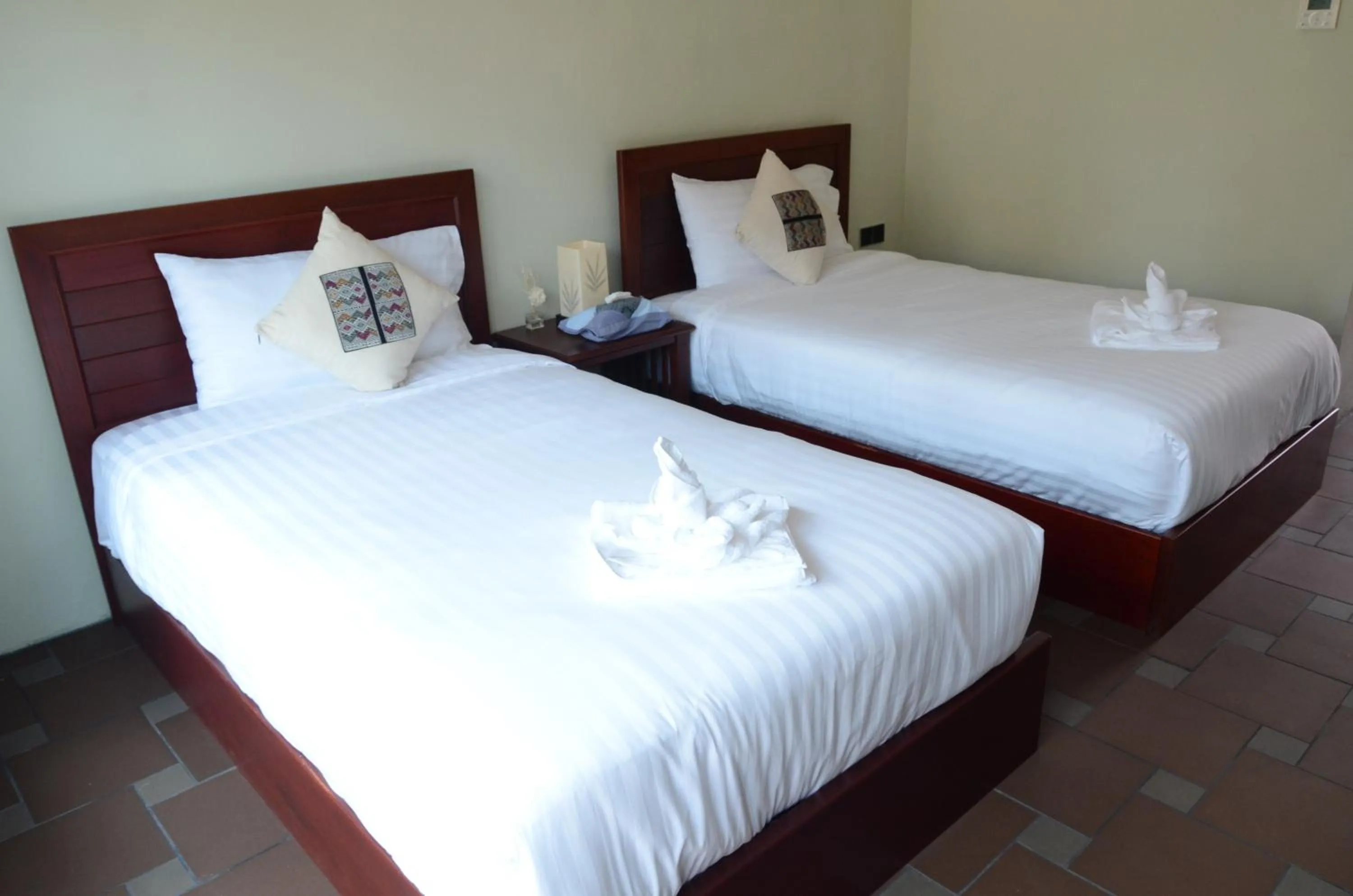 Bed in Saksiri Riverside Boutique Hotel