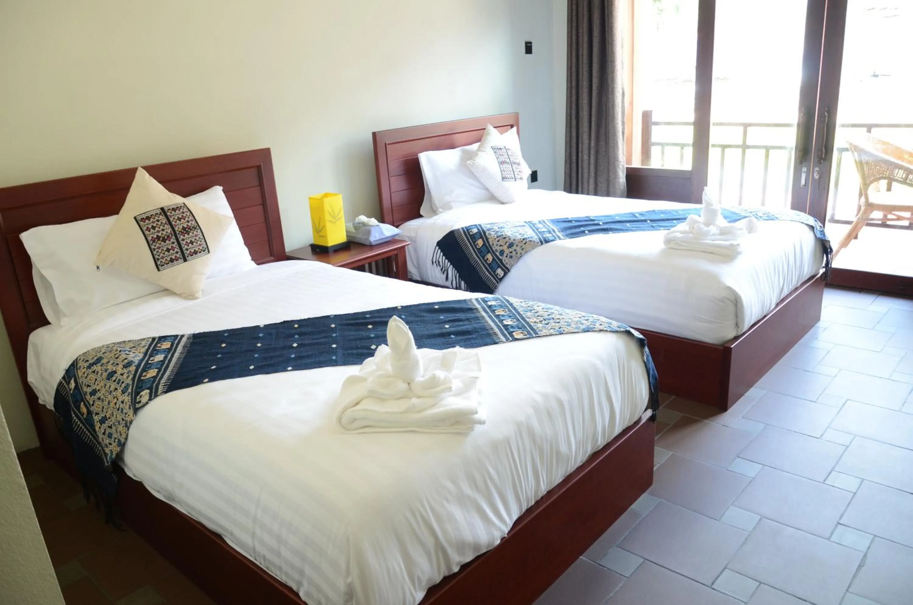 Bed in Saksiri Riverside Boutique Hotel