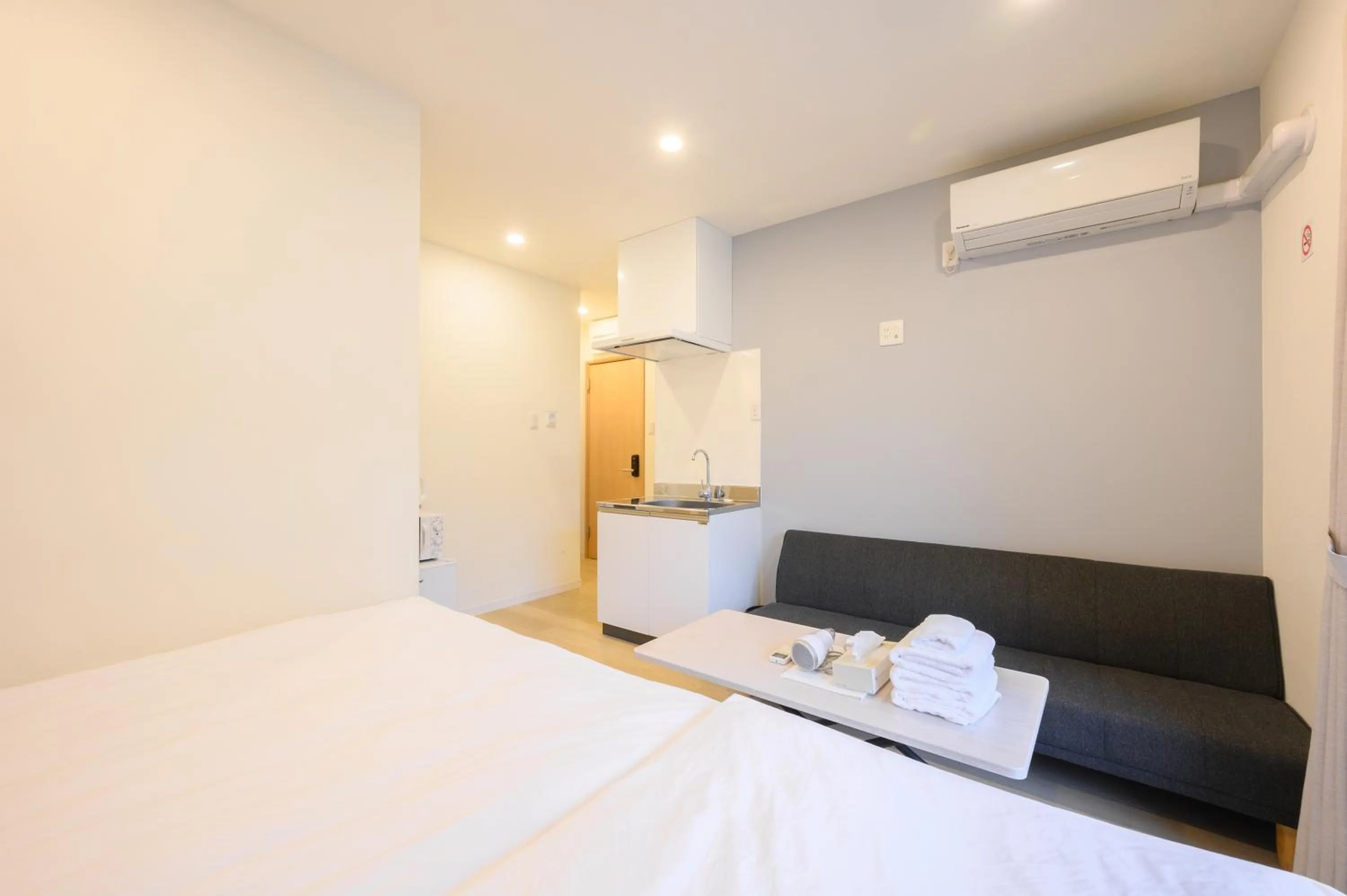 Bed in Oku Apartment