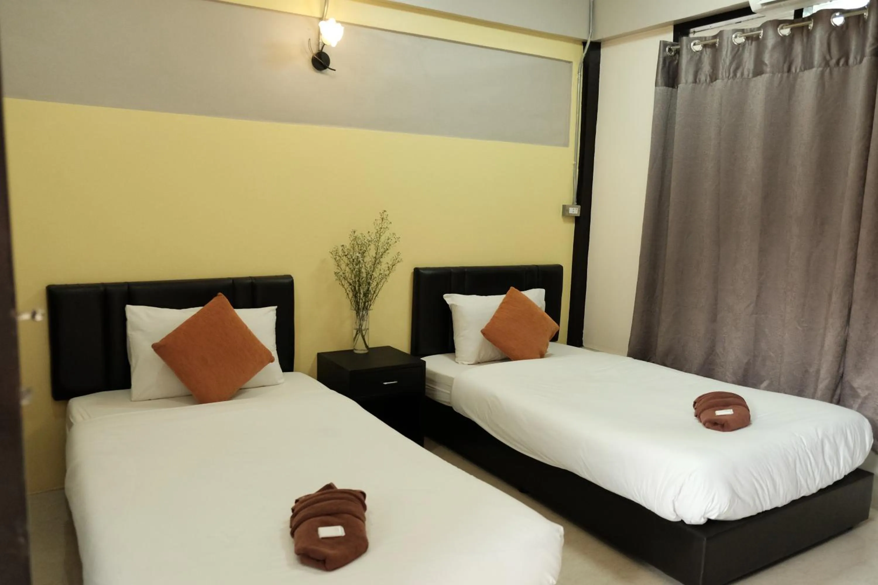 Bed in Puangpech Hotel Lampang