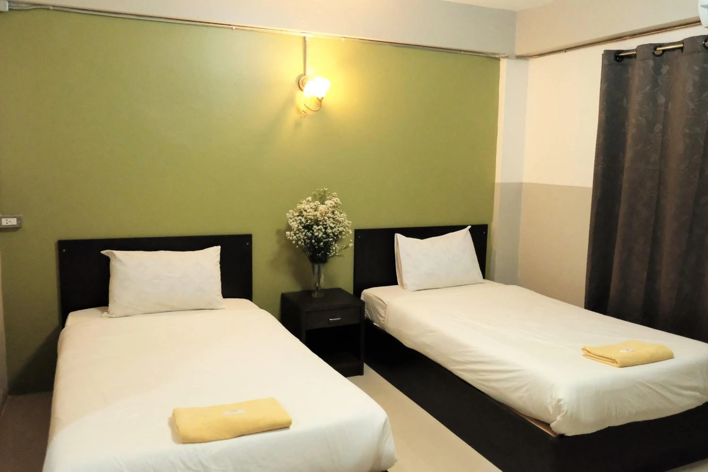 Bed in Puangpech Hotel Lampang