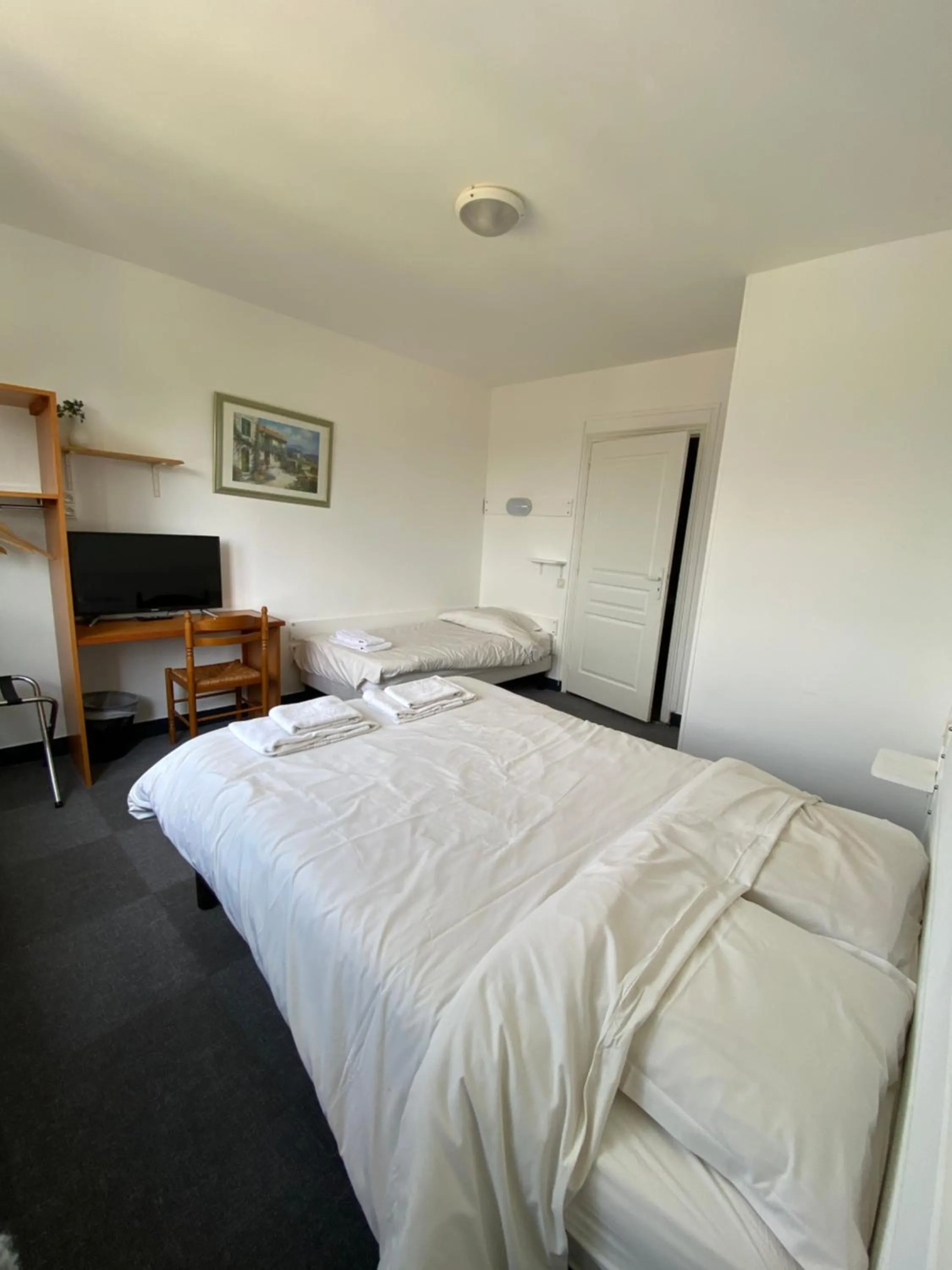 Photo of the whole room, Bed in Hotel du Centre Lucé Chartres