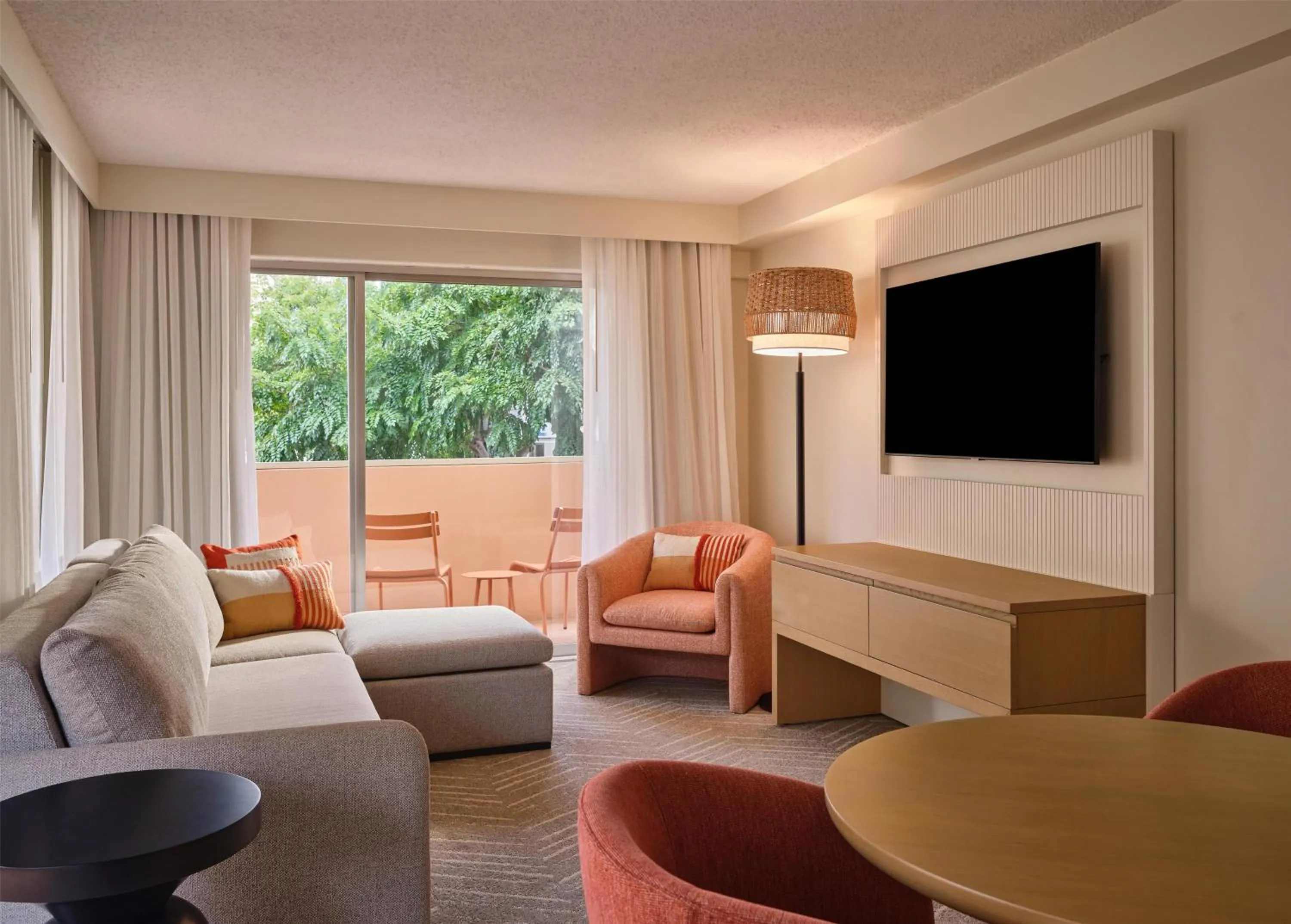 Living room in The Ambassador of Waikiki, Tapestry Collection by Hilton