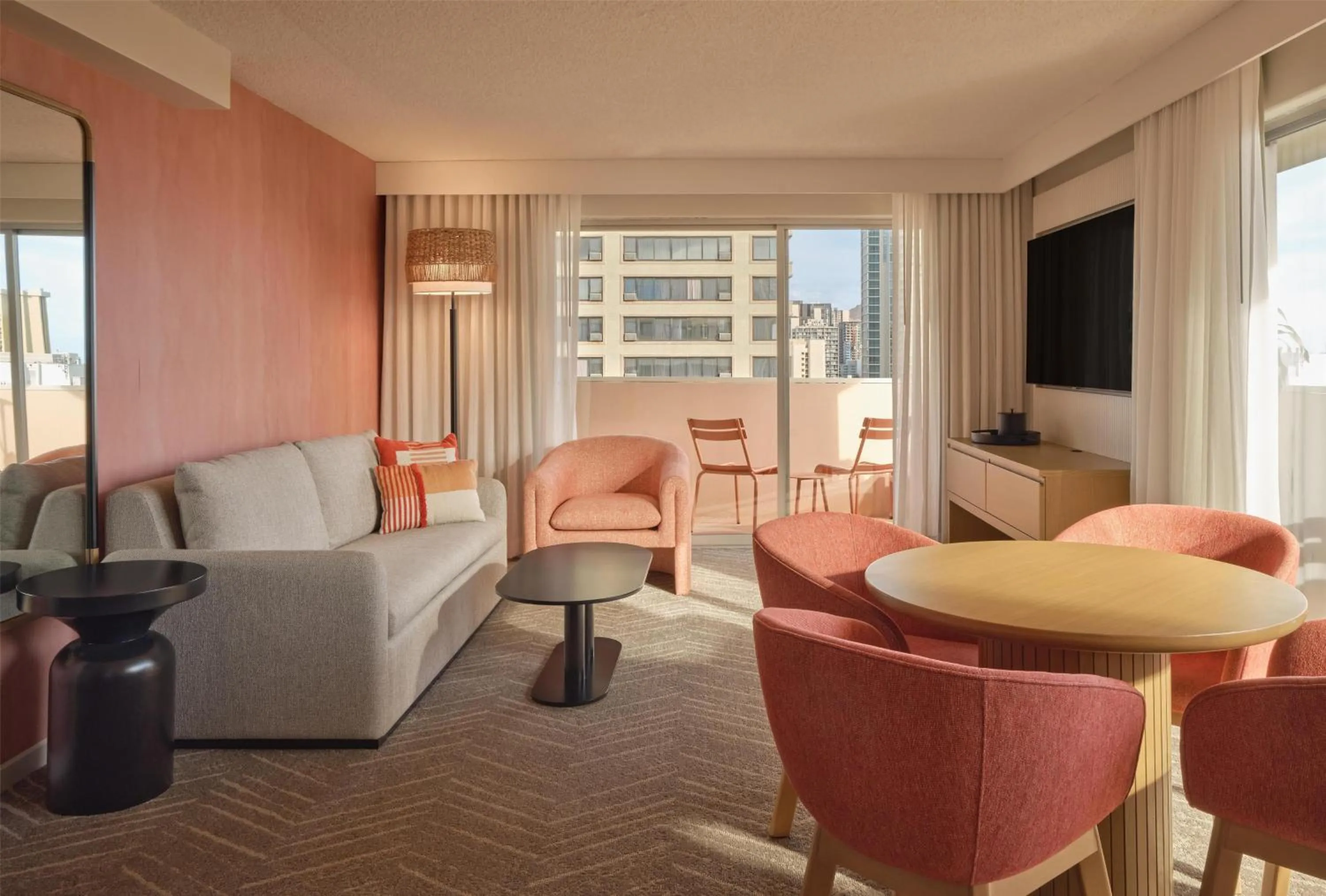 Living room in The Ambassador of Waikiki, Tapestry Collection by Hilton