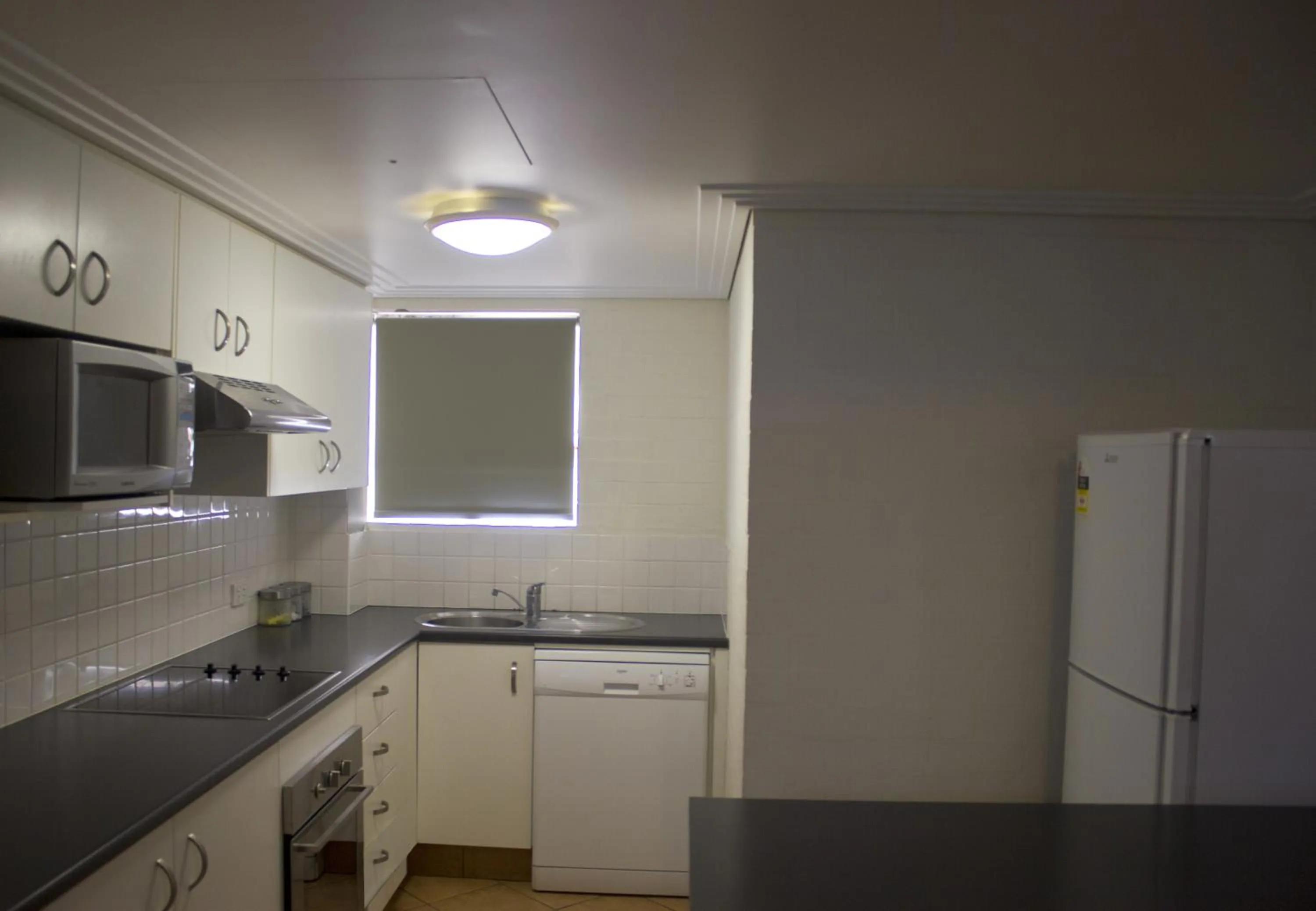 Kitchen or kitchenette in Bargara Shoreline Apartments