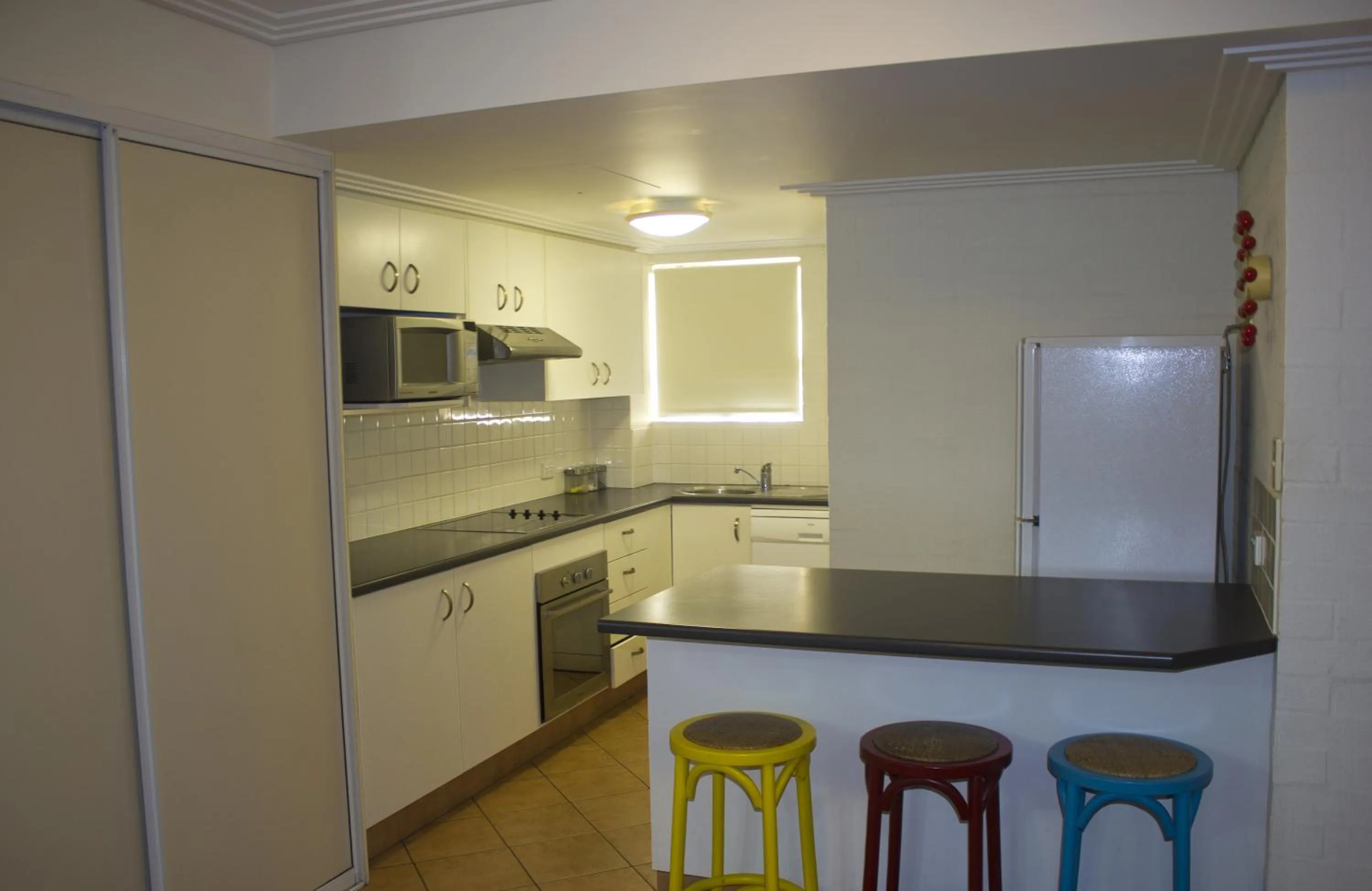 Kitchen or kitchenette in Bargara Shoreline Apartments