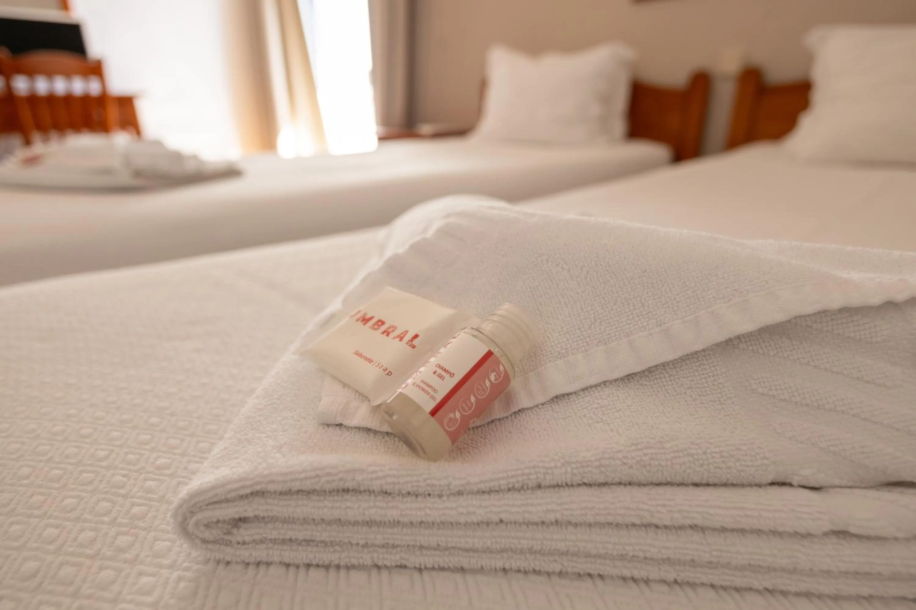 towels, Bed in Portimão Center Hotel by Umbral