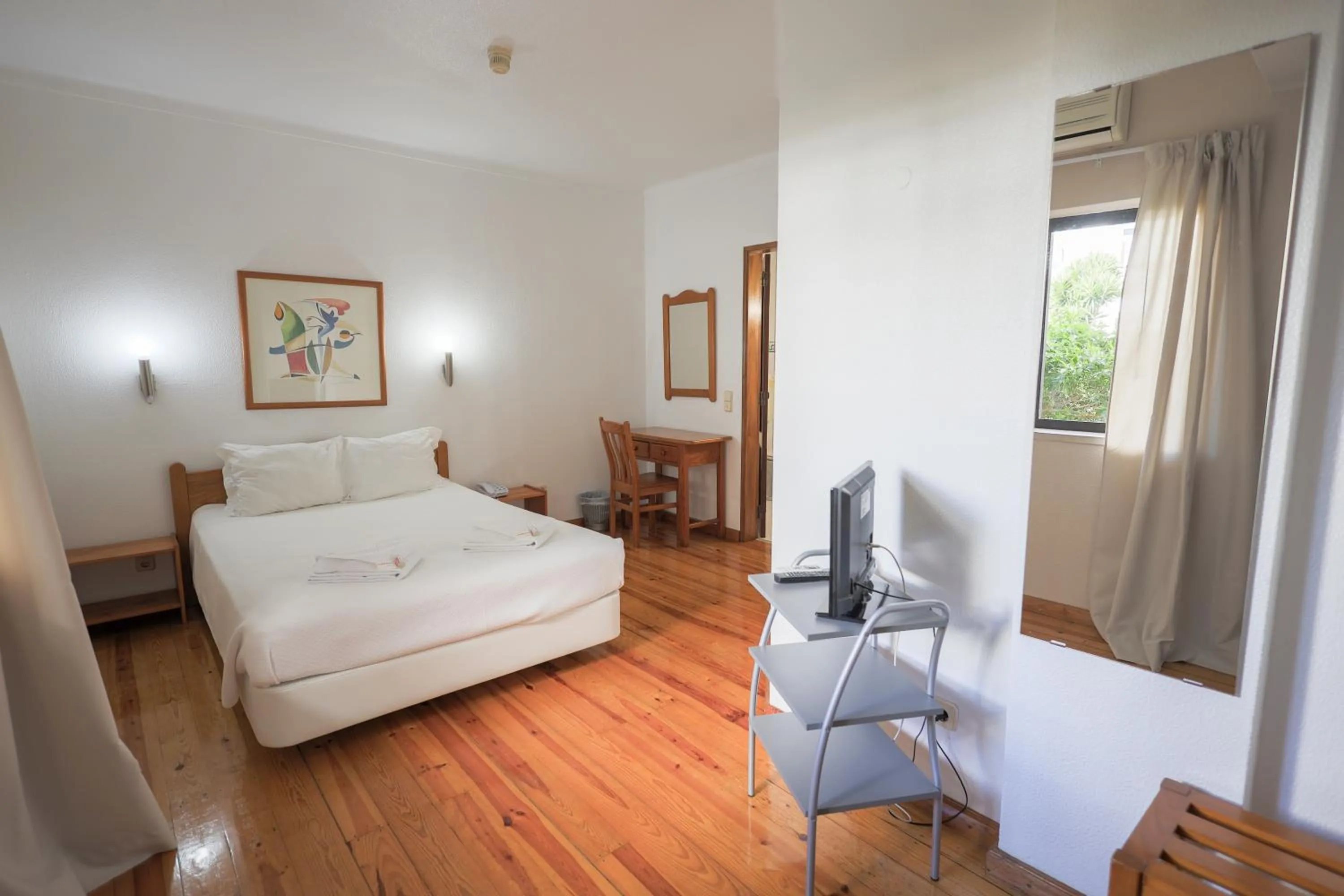 Photo of the whole room, Bed in Portimão Center Hotel by Umbral