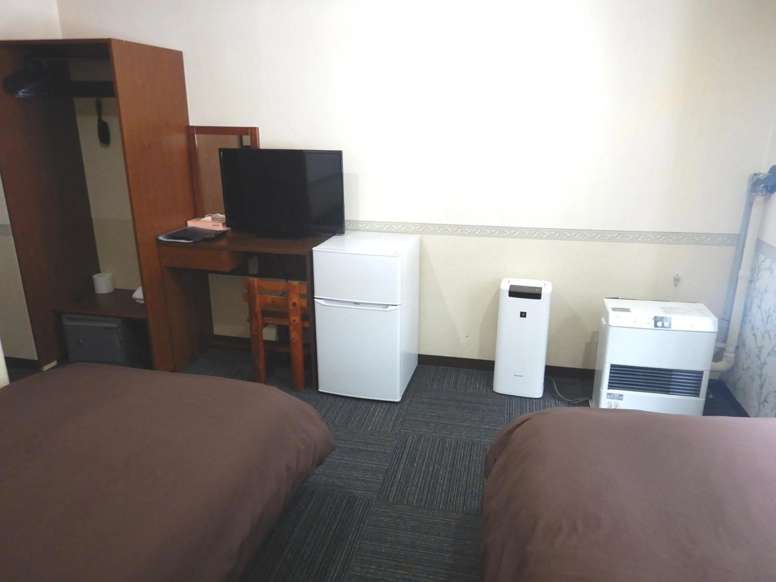 Bed in Petit Hotel Gracey Tomamu