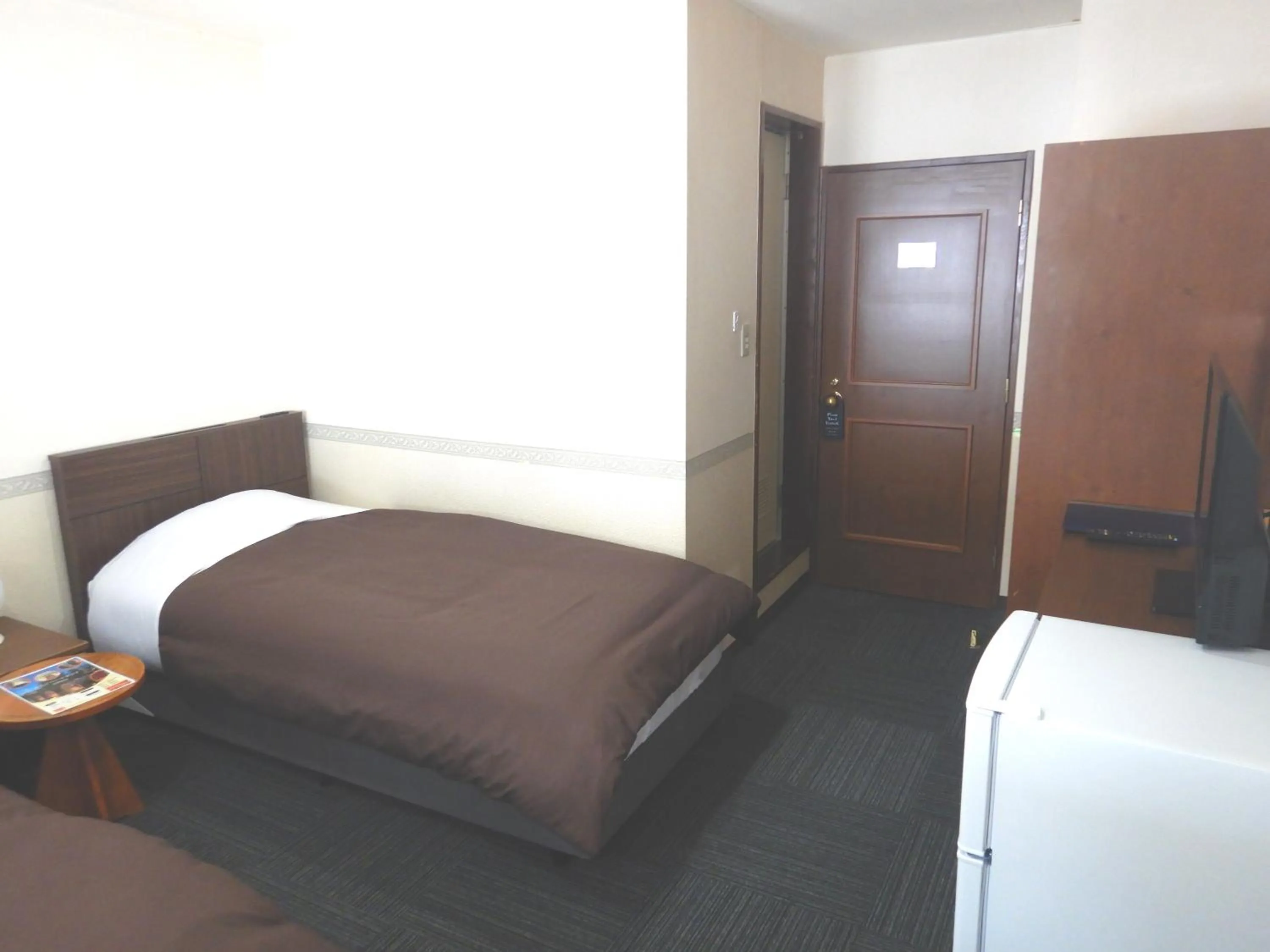 Bed in Petit Hotel Gracey Tomamu