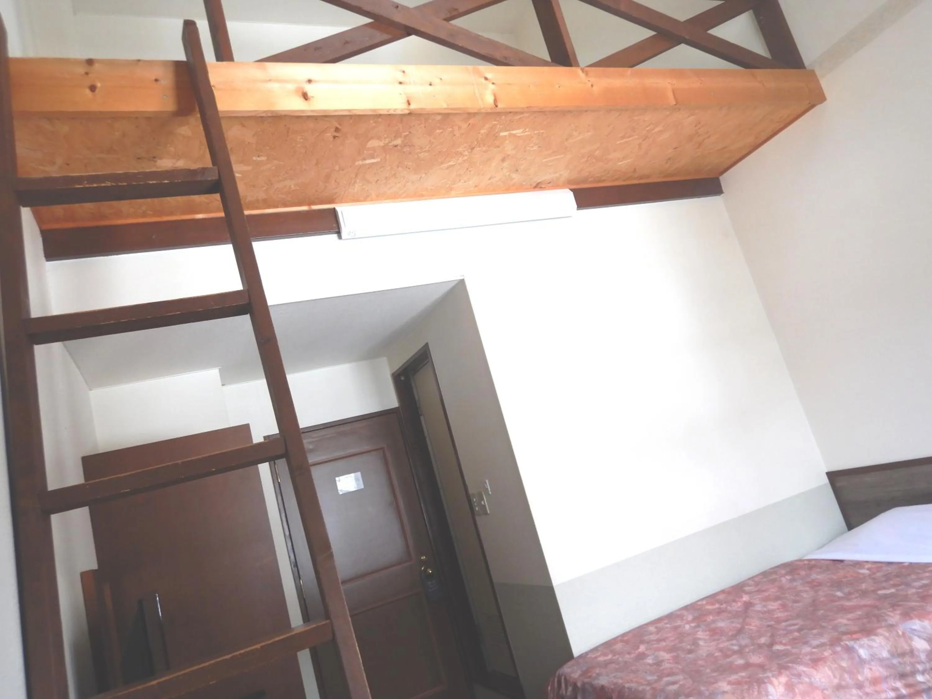 Bed in Petit Hotel Gracey Tomamu