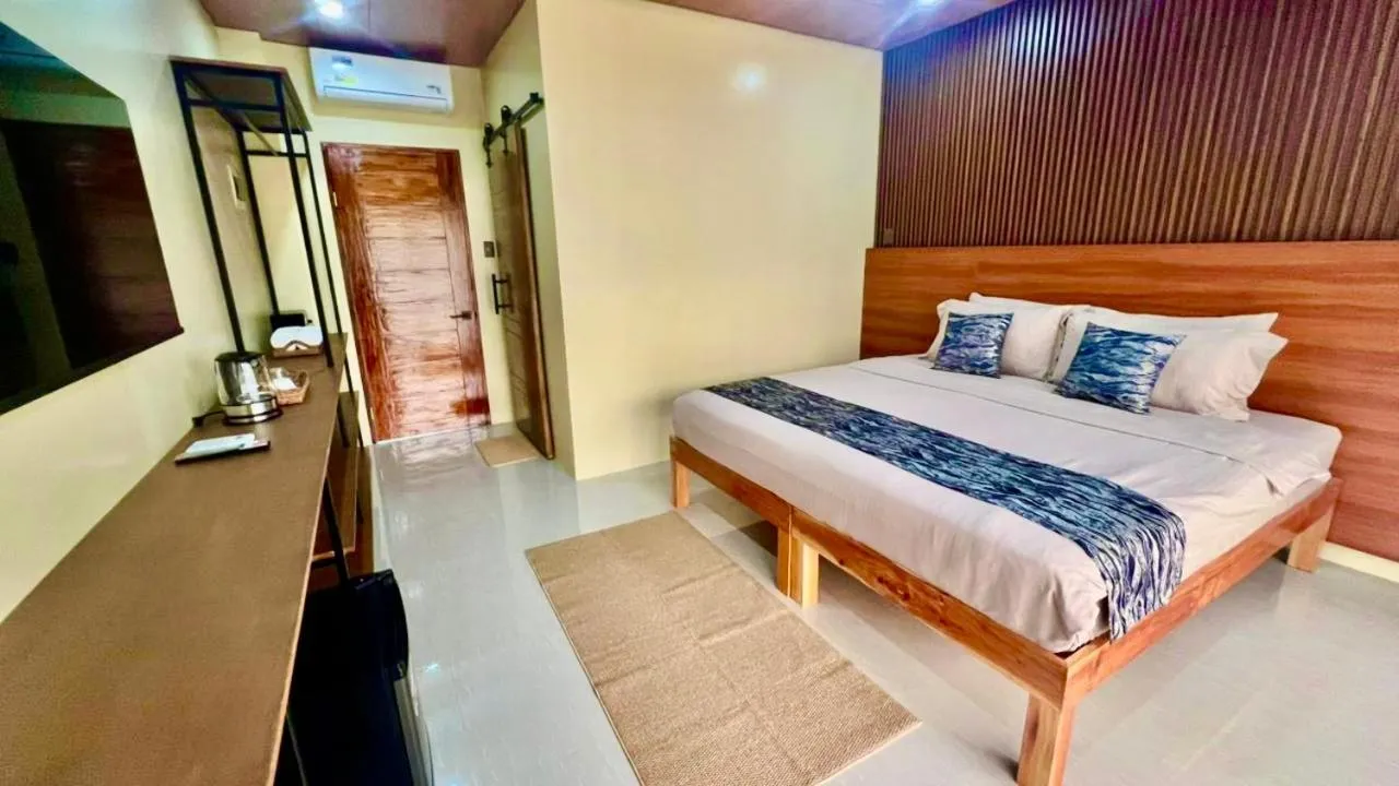 Bed in Southseas Beach Resort and Dive Center