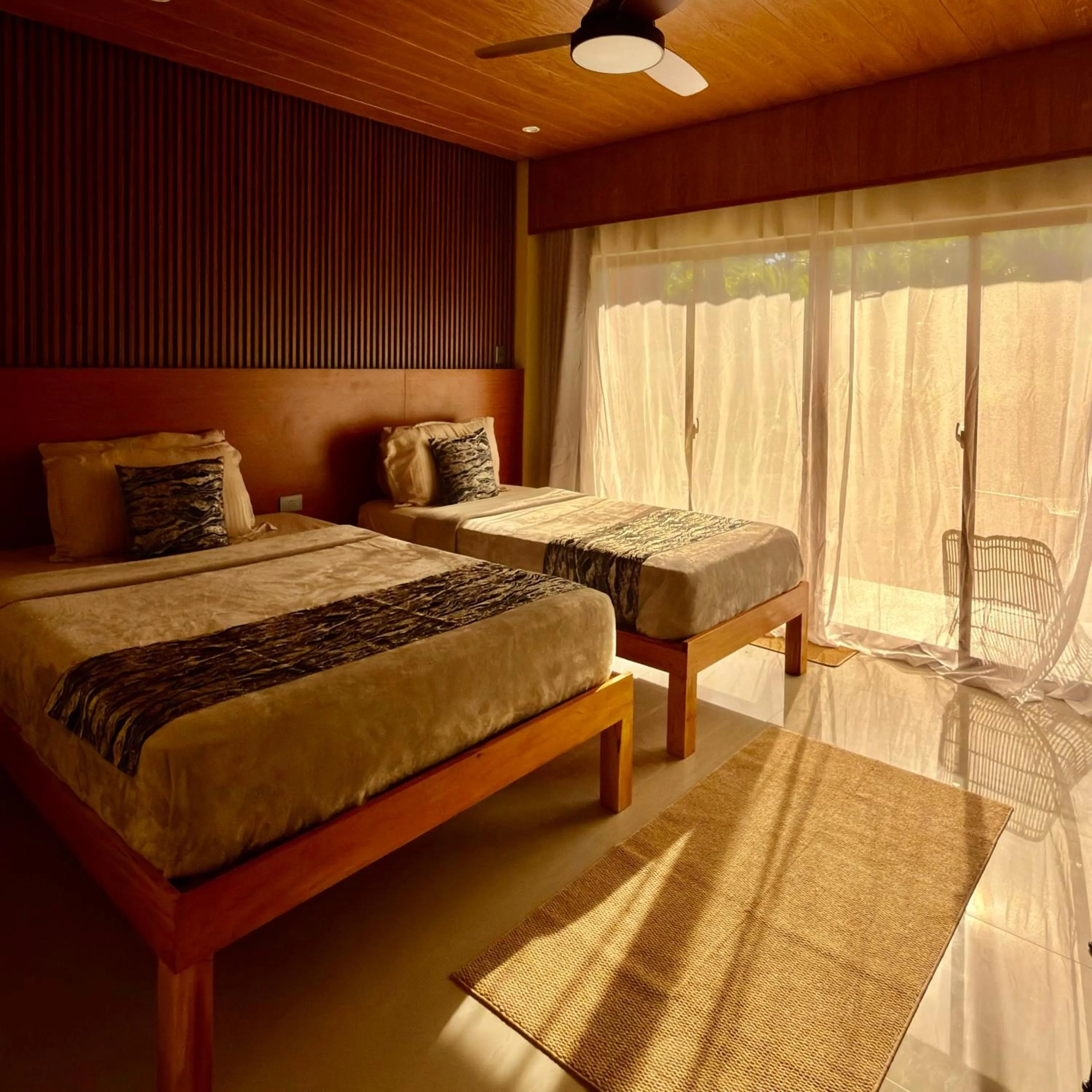 Bed in Southseas Beach Resort and Dive Center