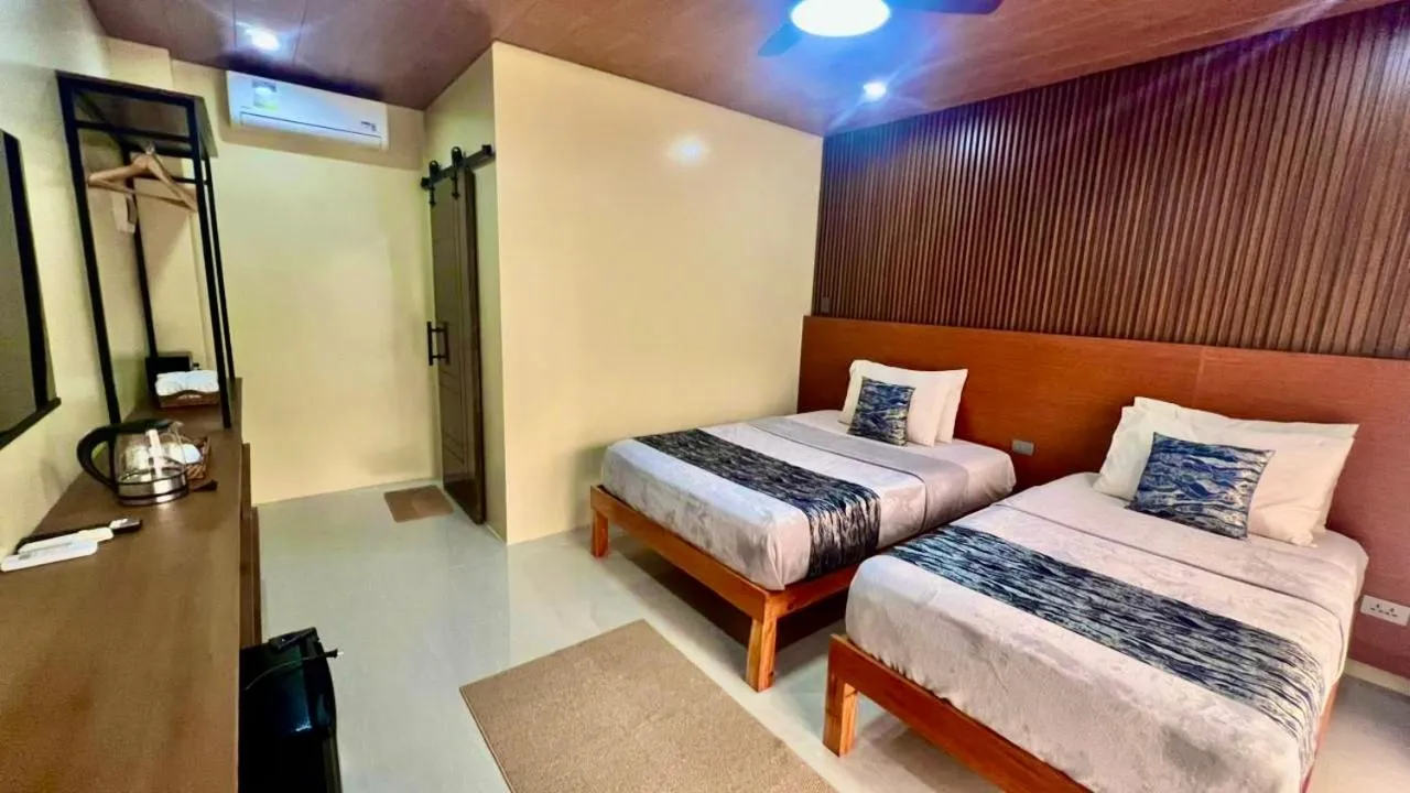 Bed in Southseas Beach Resort and Dive Center