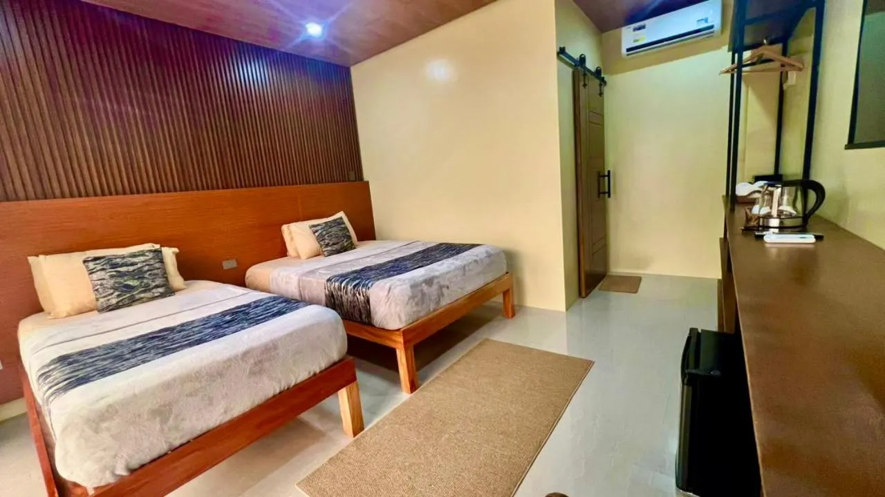 Bed in Southseas Beach Resort and Dive Center