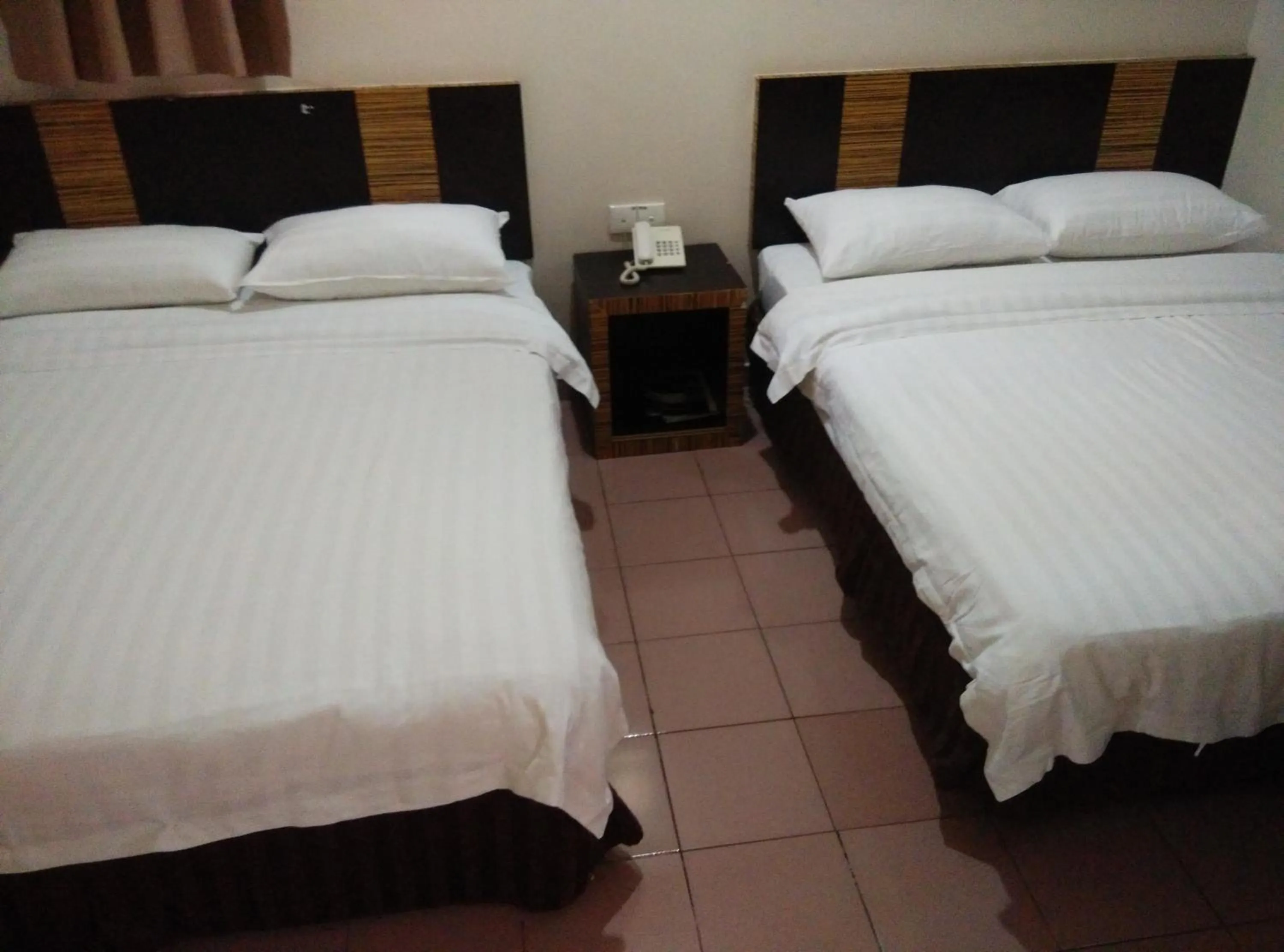 Bed in Hotel Traveller