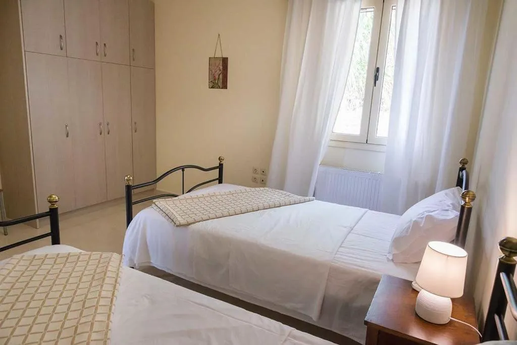 Bed in Monambeles Villas