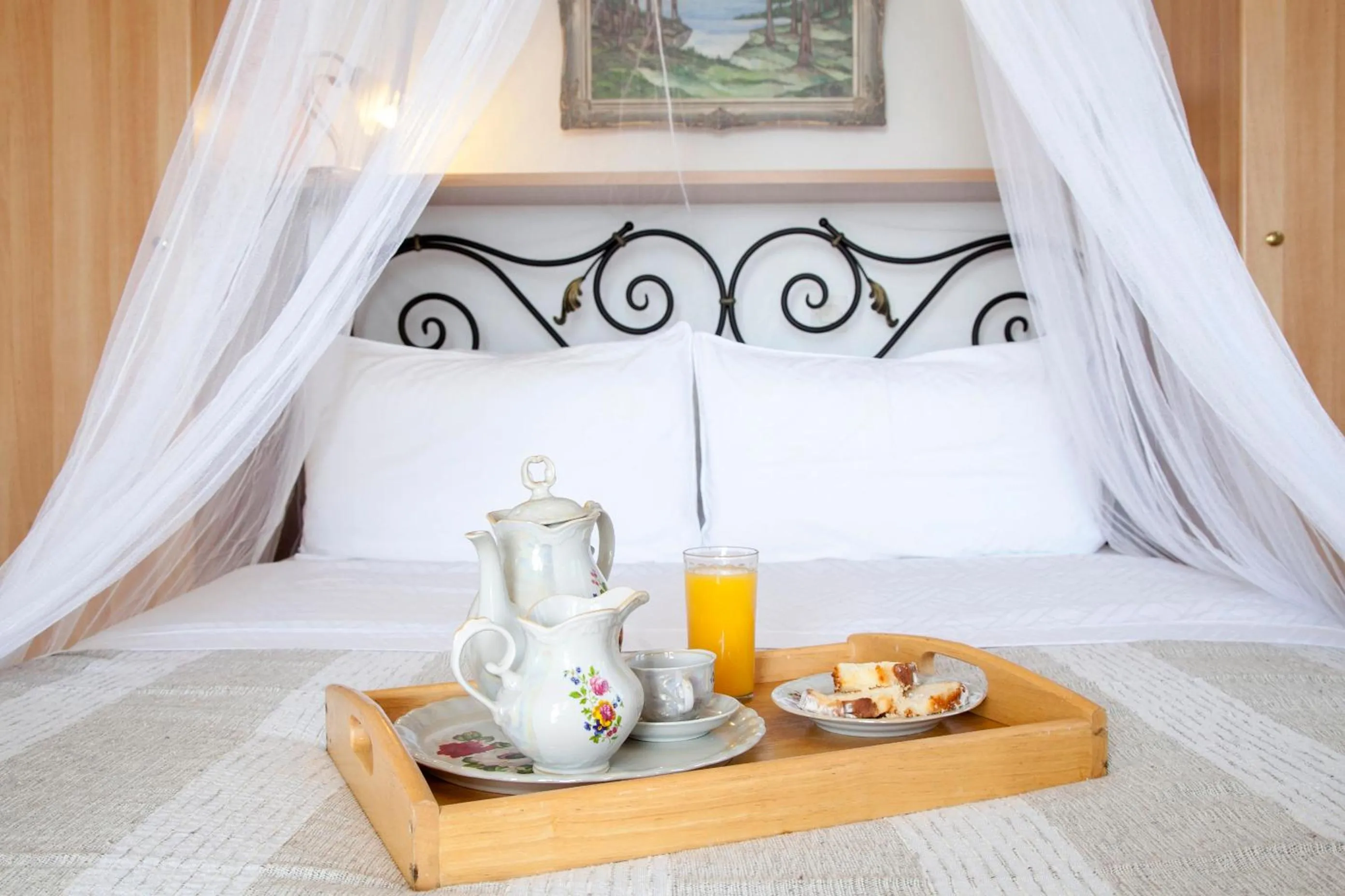 Bed in Monambeles Villas