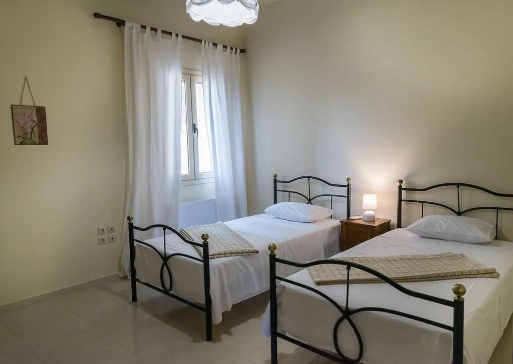 Bed in Monambeles Villas