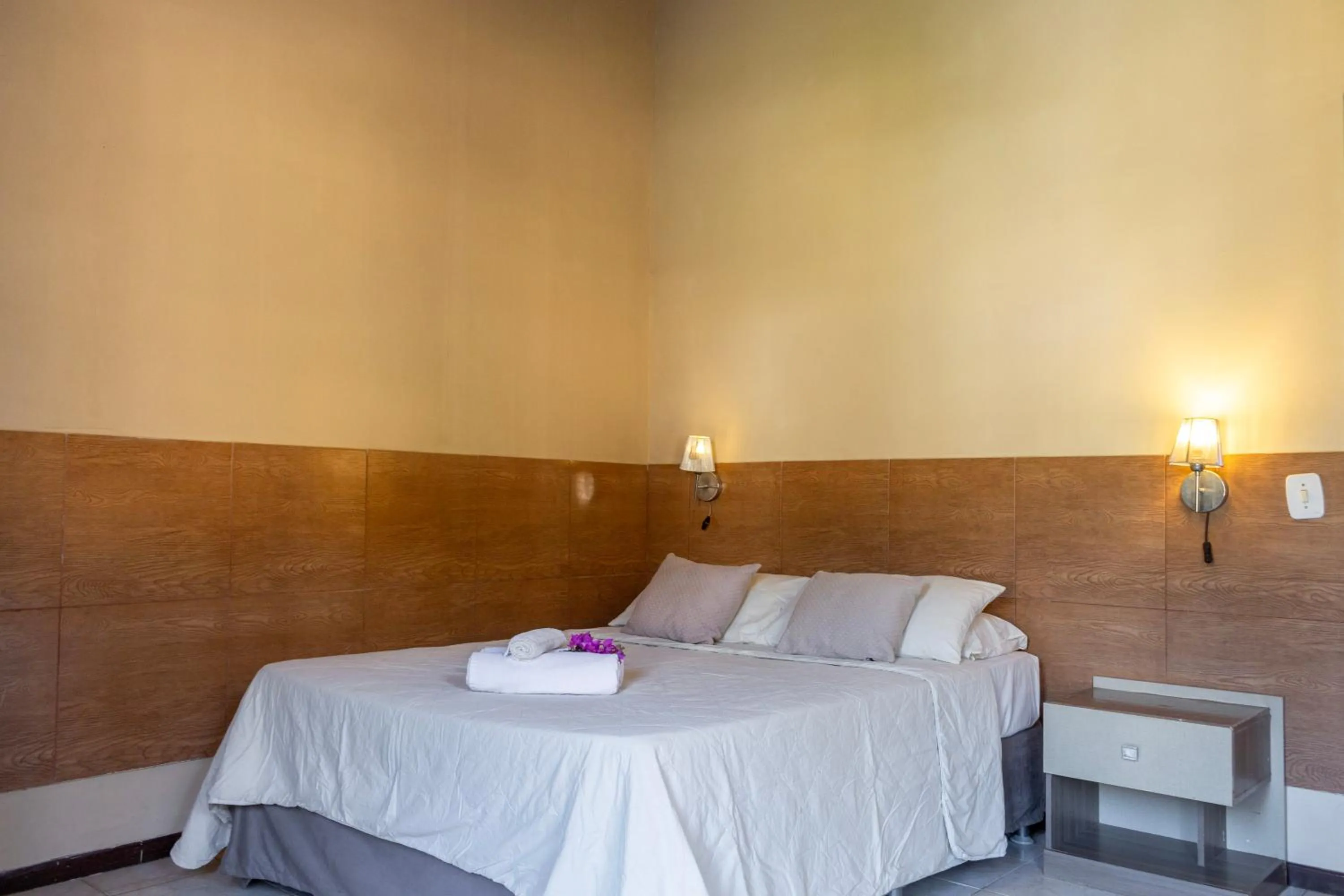 Bed in Pousada New Paradise