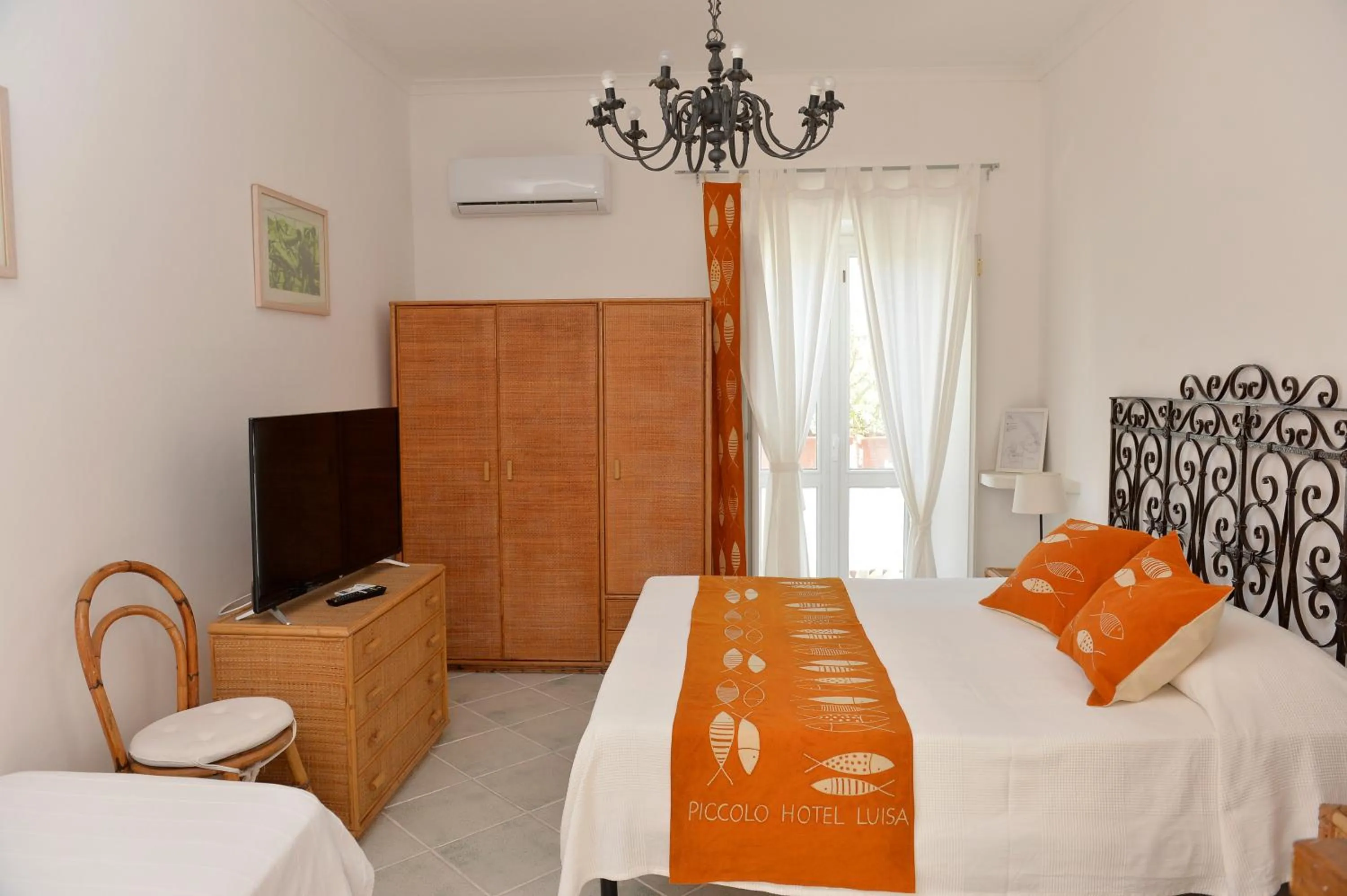 Bed in Piccolo Hotel Luisa