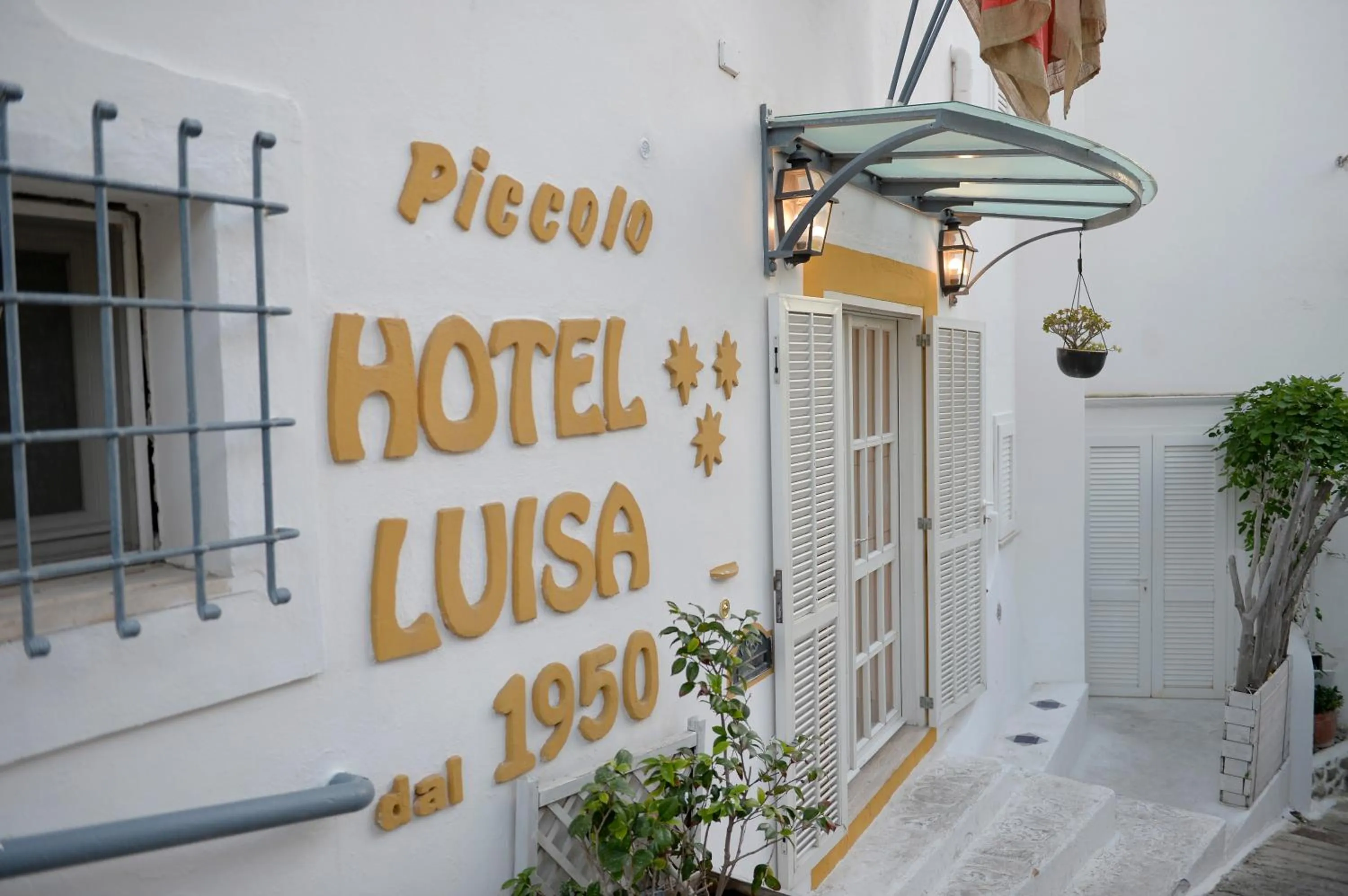 Property logo or sign in Piccolo Hotel Luisa
