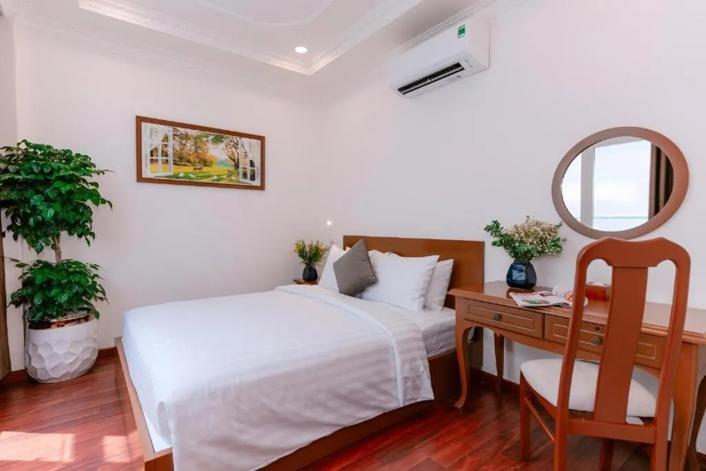 Bed in DAHLIALAND SAIGON HOTEL & SWIMMING PooL