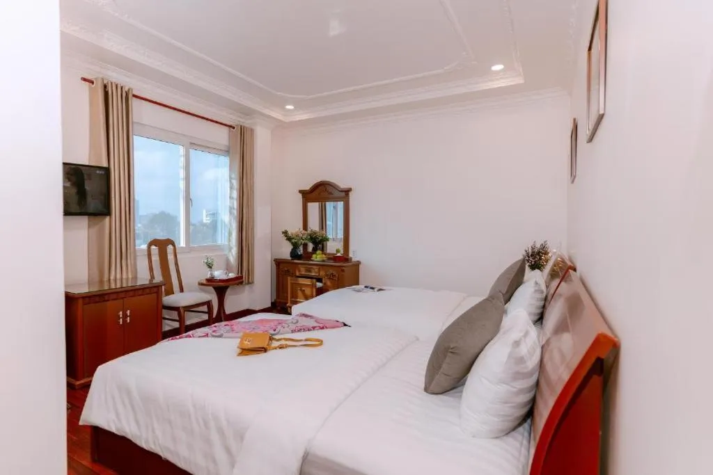 Bed in DAHLIALAND SAIGON HOTEL & SWIMMING PooL