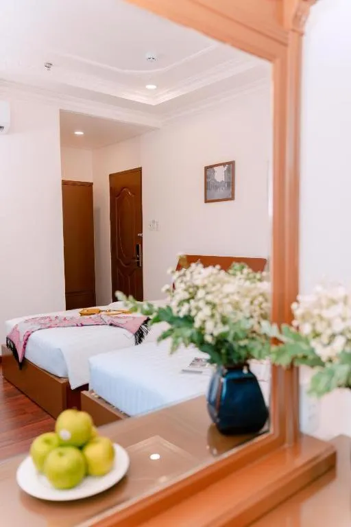 Bed in DAHLIALAND SAIGON HOTEL & SWIMMING PooL