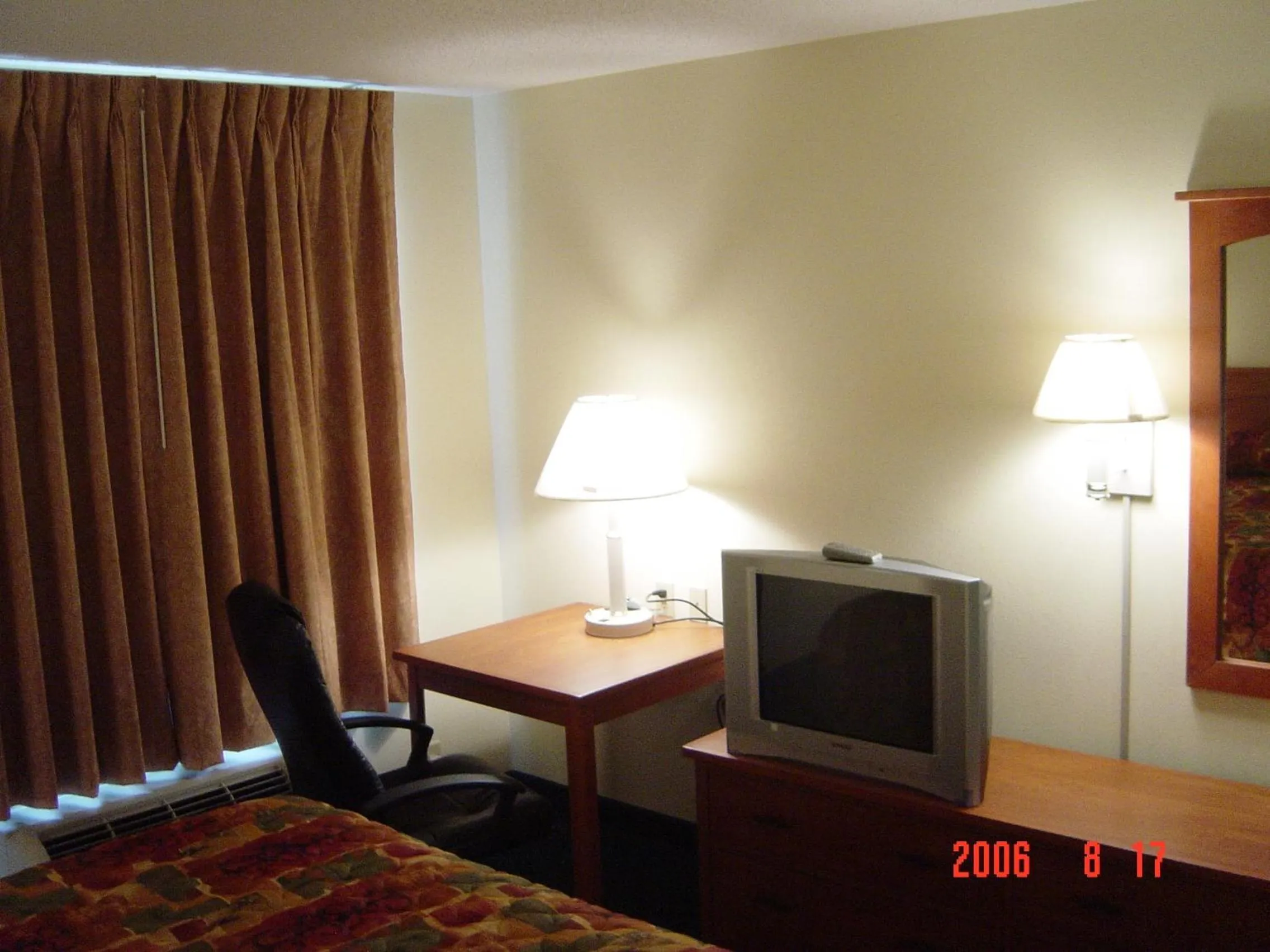 Bed in Hometown Inn & Suites