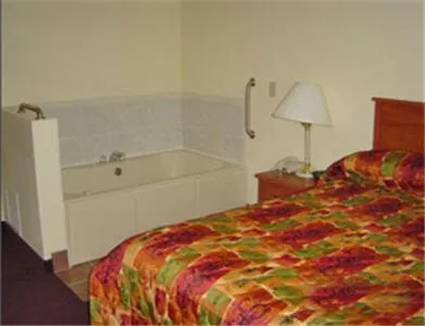 Bed in Hometown Inn & Suites