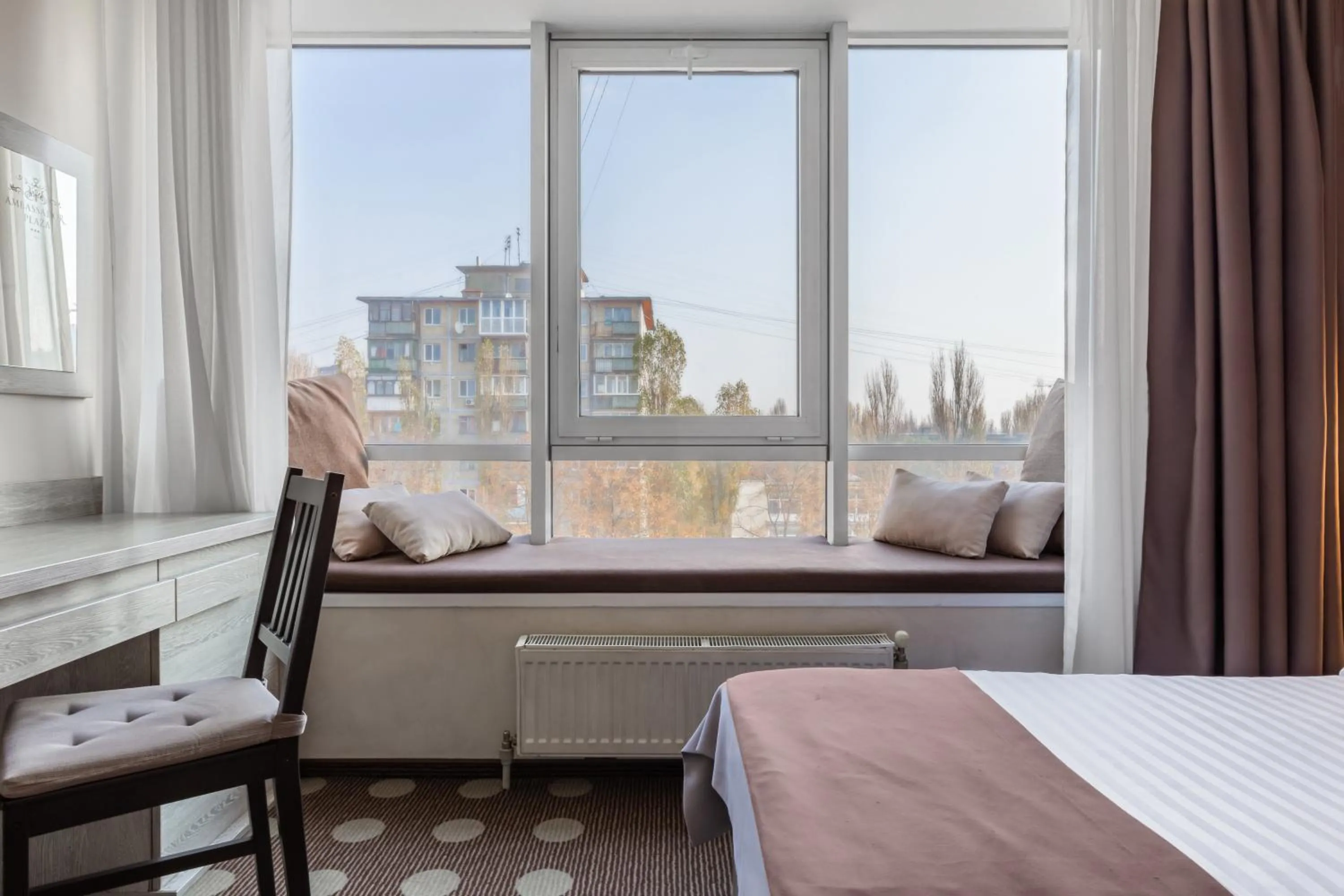 City view, Bed in Ambassador Plaza