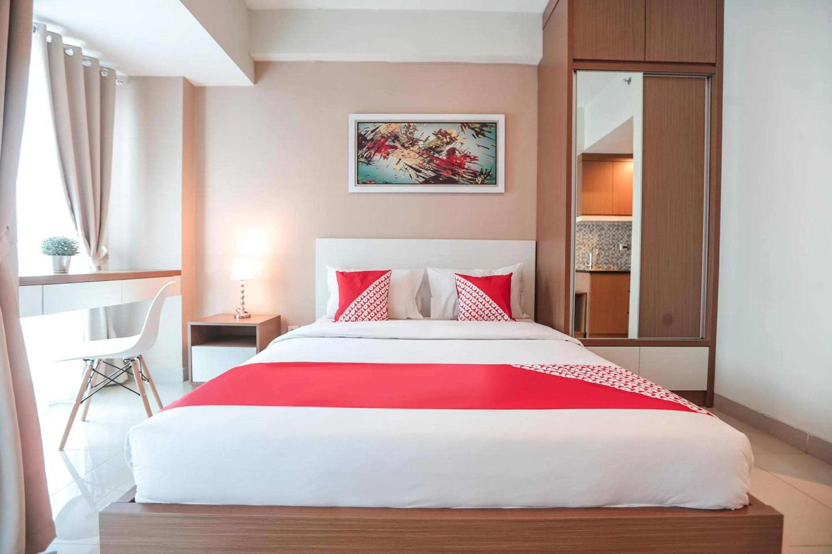 Bedroom in OYO  Flagship 755 Appartel Grand Dhika City