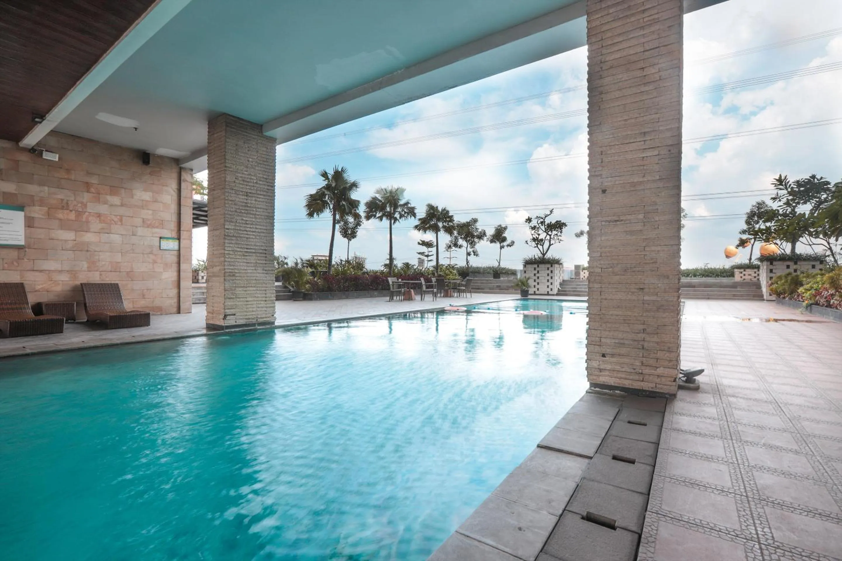 Swimming Pool in OYO  Flagship 755 Appartel Grand Dhika City