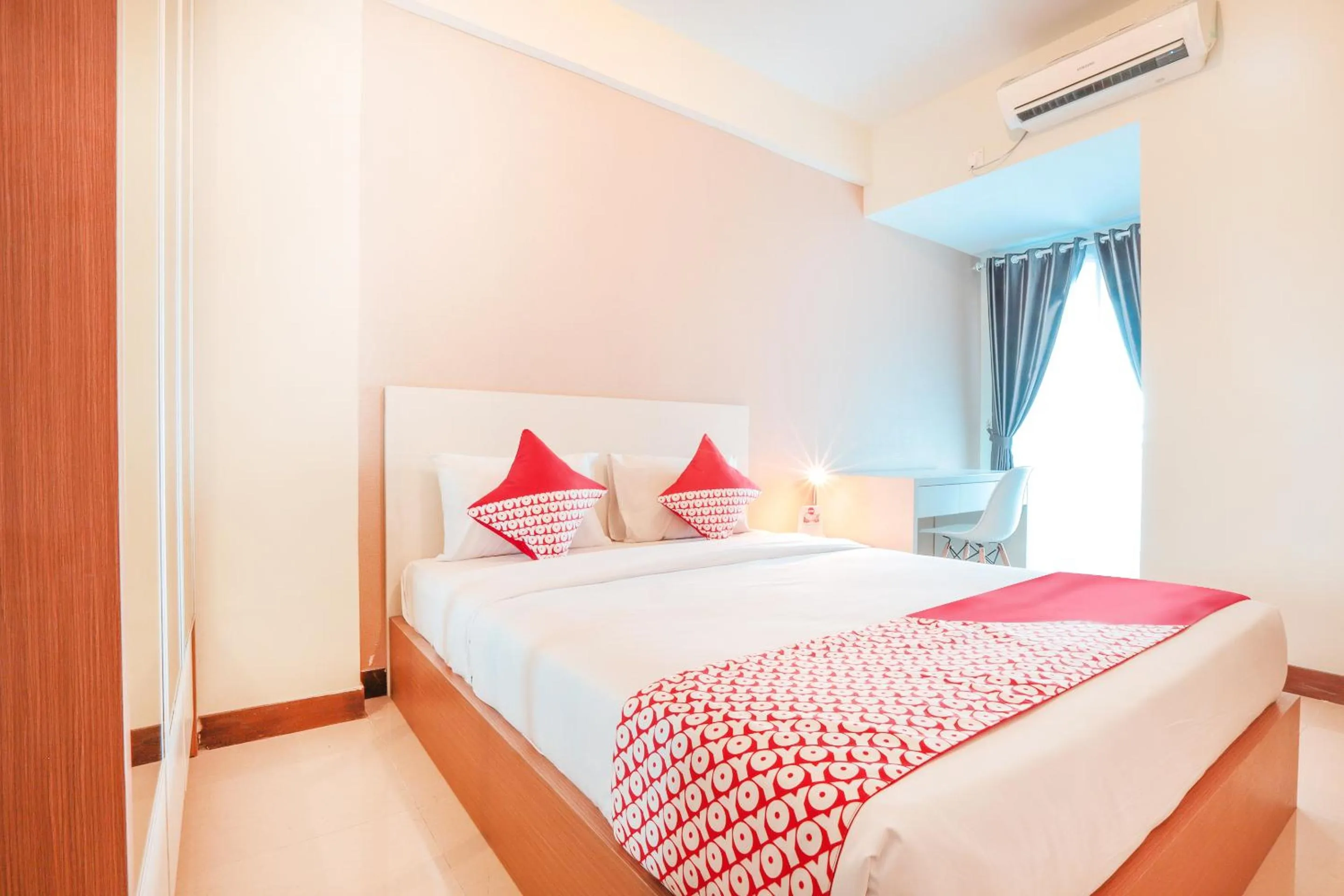 Bedroom in OYO  Flagship 755 Appartel Grand Dhika City